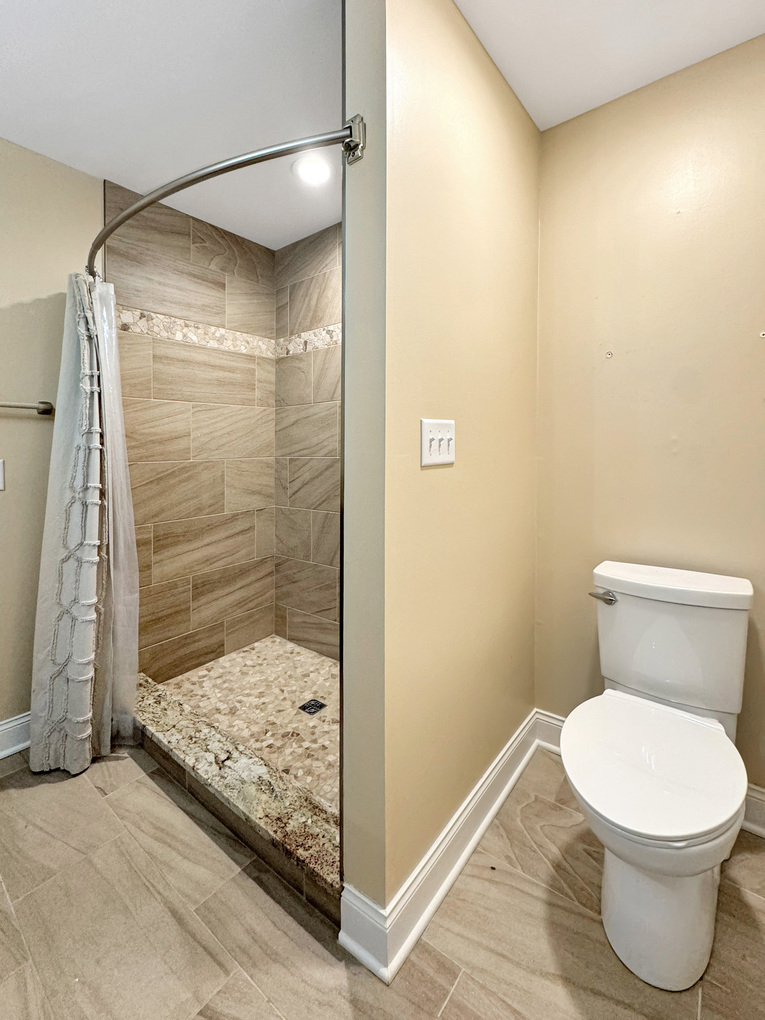 1669 Barberry Circle Freeport, IL 61032 - Photo 43 of 67 a bathroom with a toilet and a shower