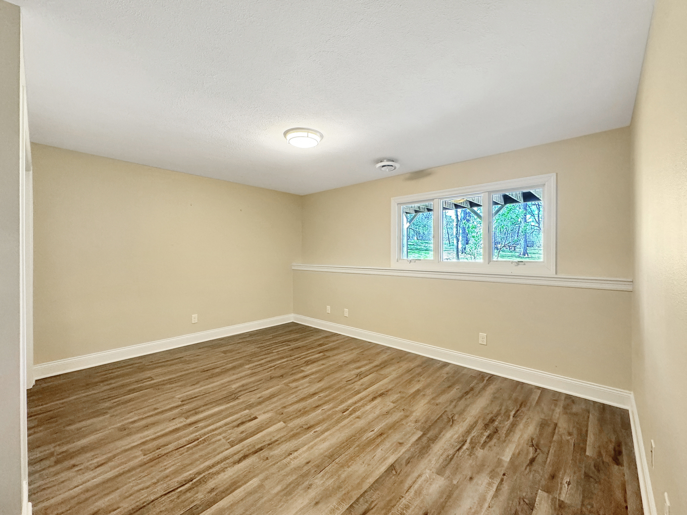 1669 Barberry Circle Freeport, IL 61032 - Photo 45 of 67 an empty room with wooden floor and a window