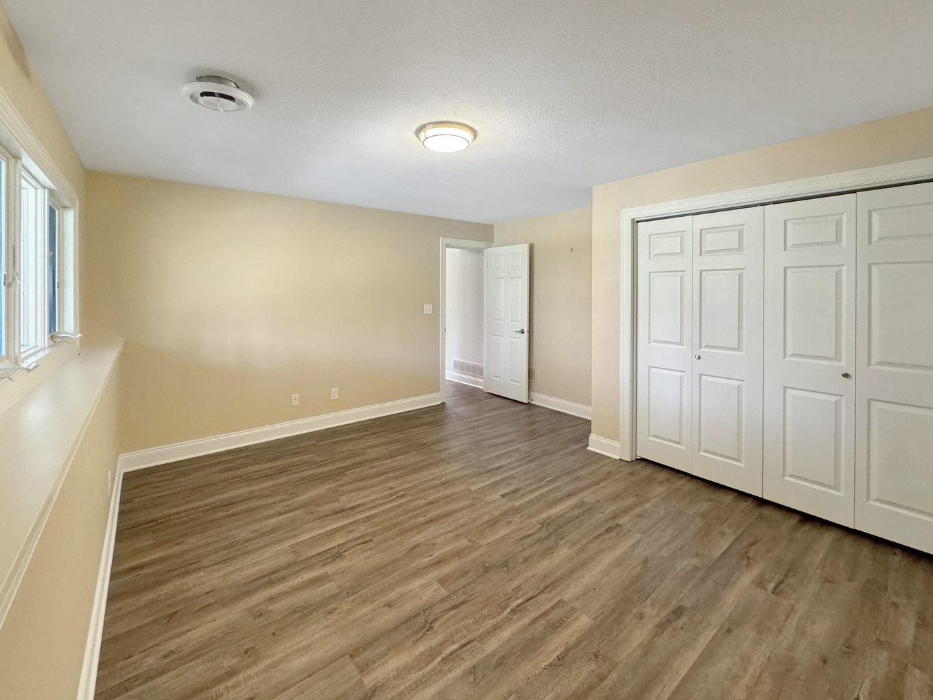 1669 Barberry Circle Freeport, IL 61032 - Photo 46 of 67 a view of an empty room with wooden floor and a window