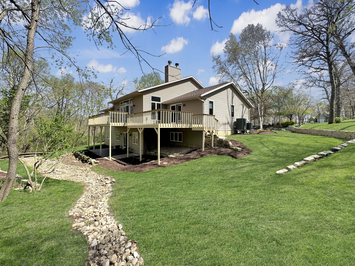 1669 Barberry Circle Freeport, IL 61032 - Photo 52 of 67 a view of a house with a yard patio and fire pit
