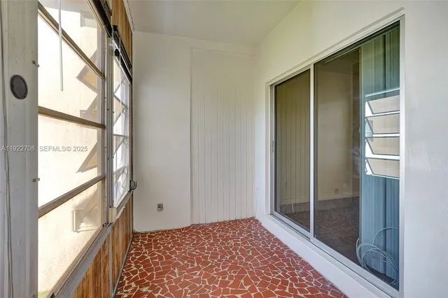 a view of a closet area with a glass door