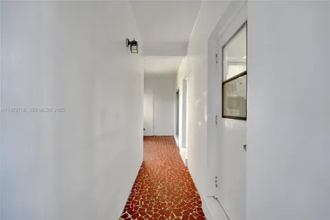 a view of a balcony with wooden floor