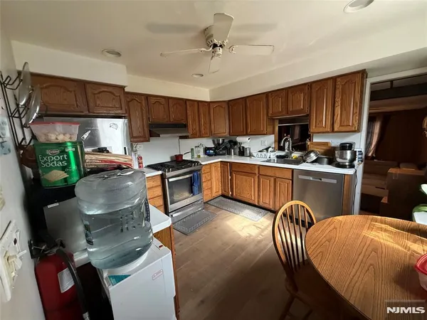 a kitchen with a sink a window and appliances