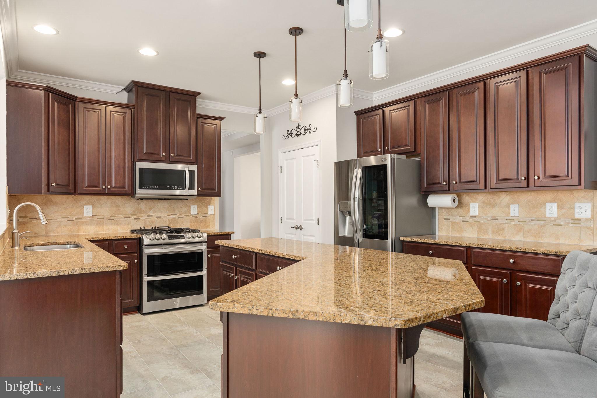9417 Reservoir Road Fredericksburg, VA 22407 - Photo 19 of 80 Elegant kitchen with rich cabinetry.