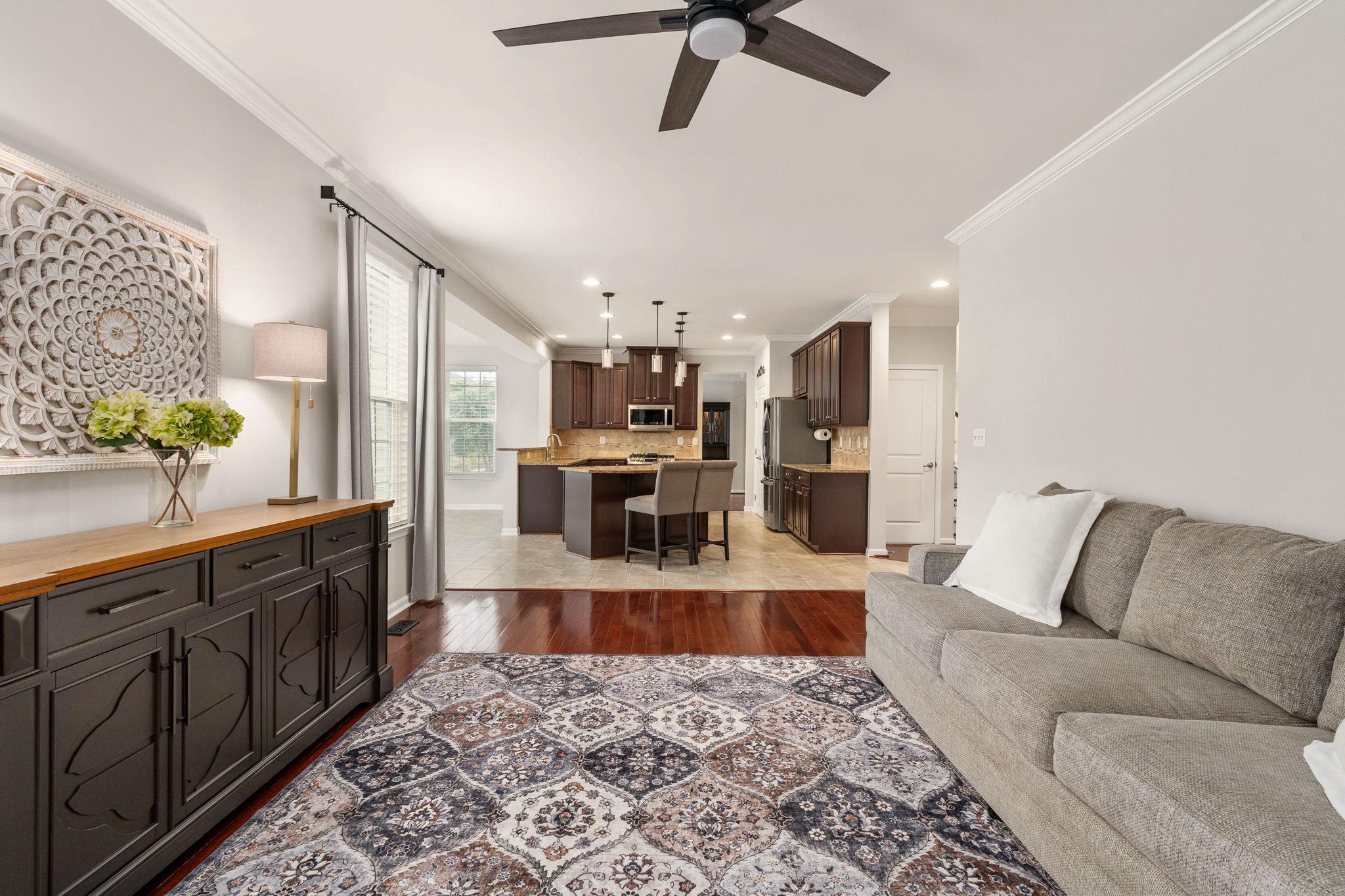 9417 Reservoir Road Fredericksburg, VA 22407 - Photo 24 of 76 a living room with stainless steel appliances granite countertop furniture wooden floor and a view of kitchen