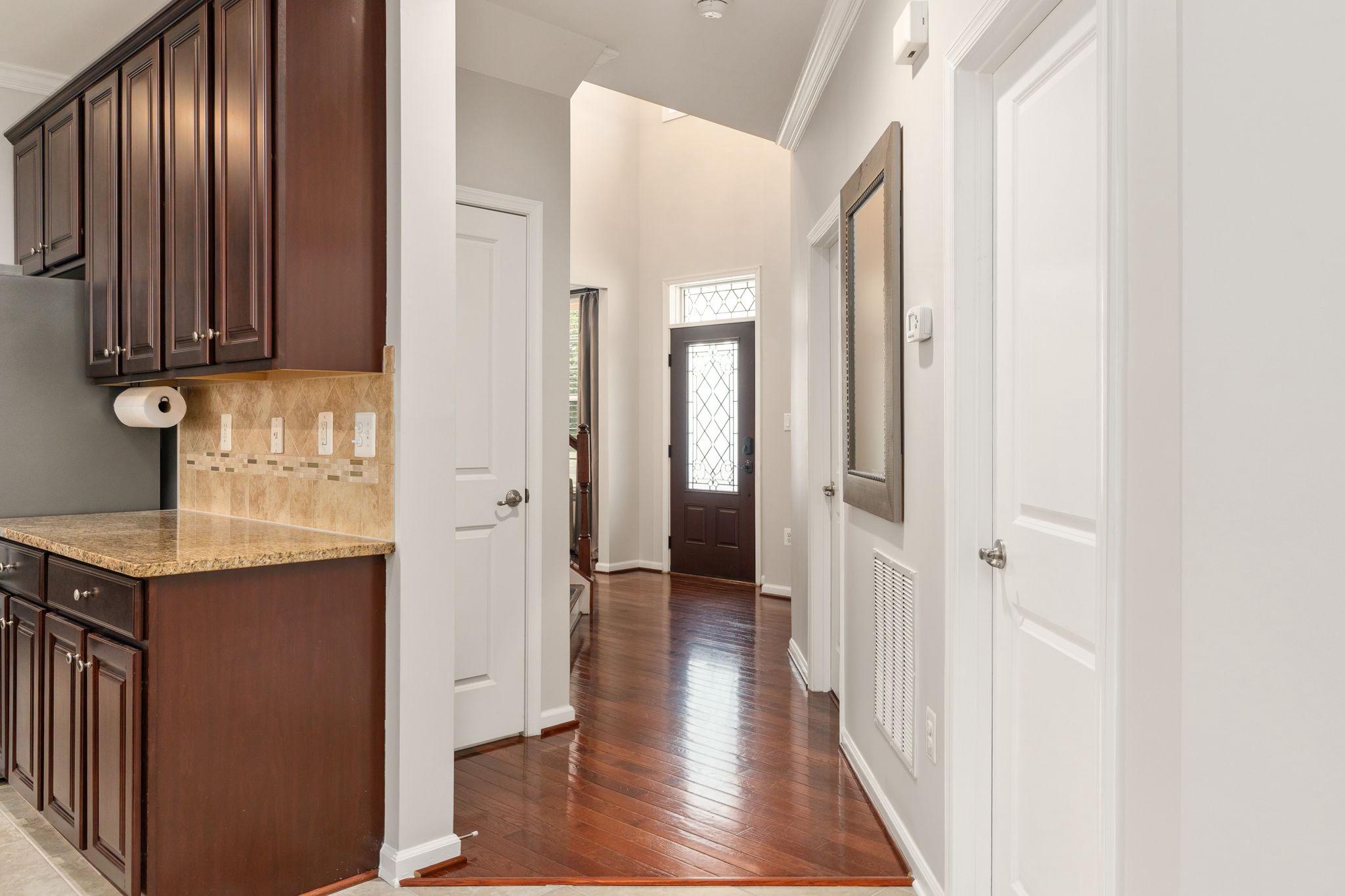 9417 Reservoir Road Fredericksburg, VA 22407 - Photo 27 of 76 a view of a hallway with wooden floor