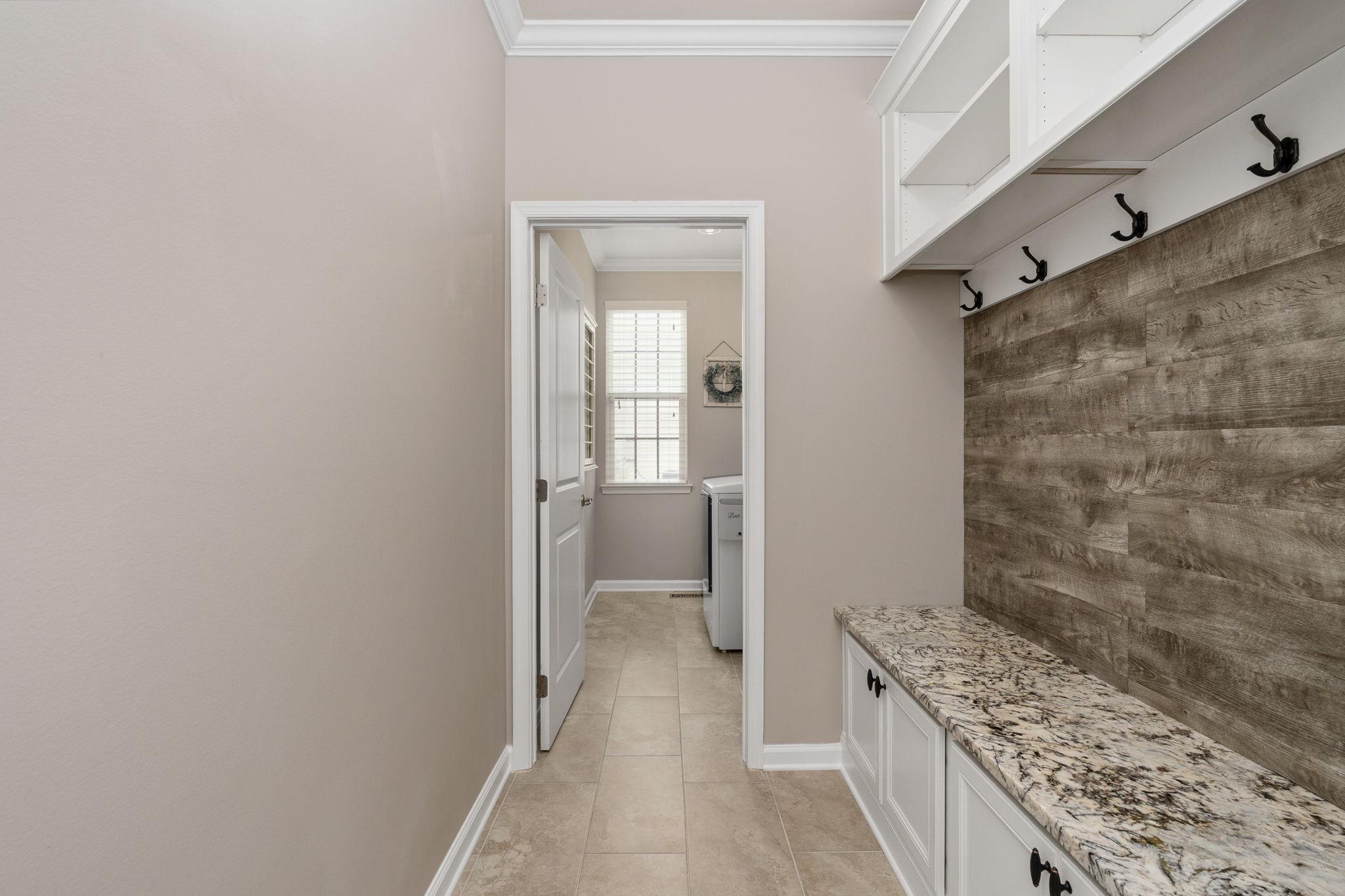 9417 Reservoir Road Fredericksburg, VA 22407 - Photo 28 of 76 a bathroom with a granite countertop sink a toilet and shower