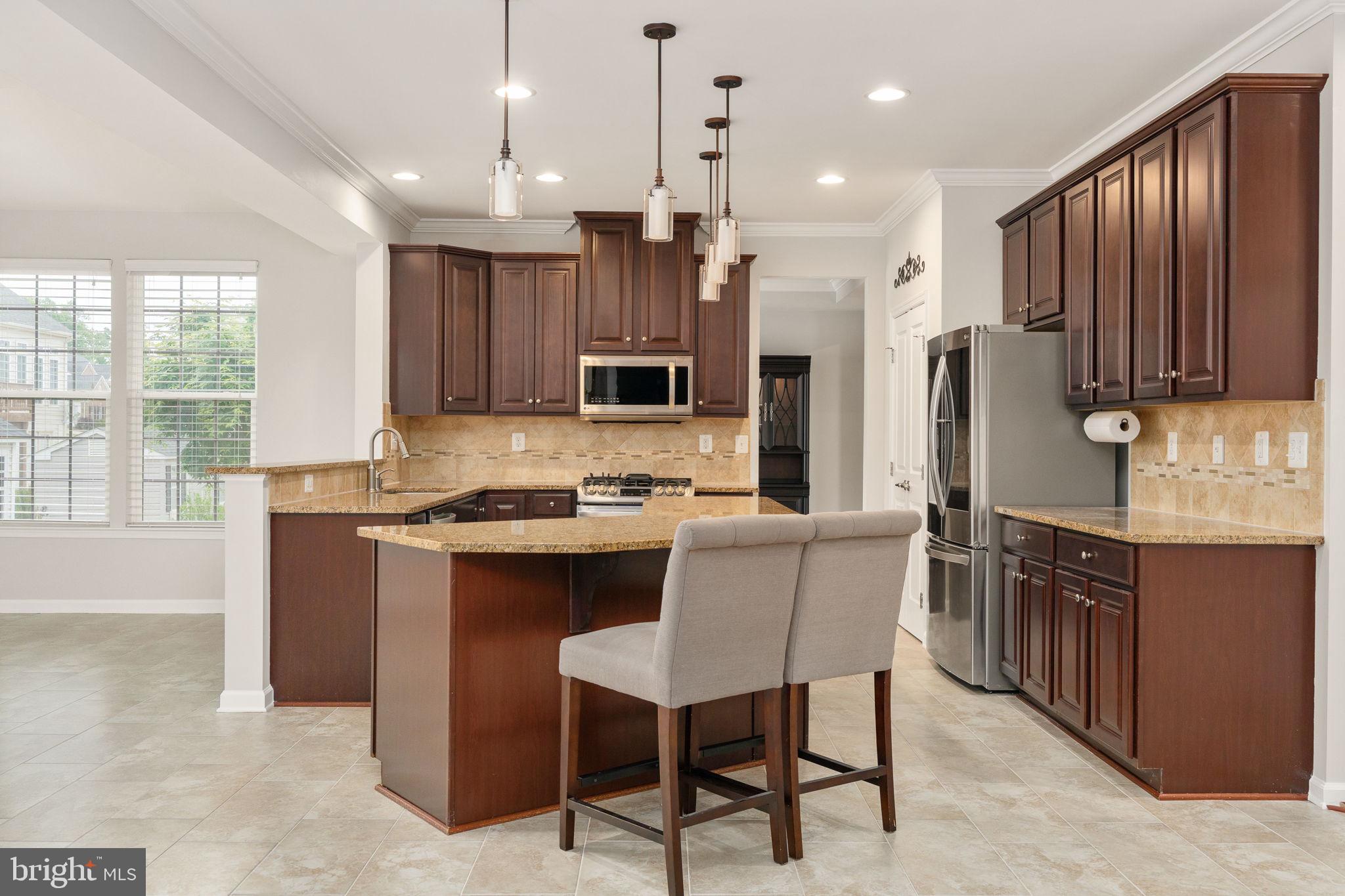 9417 Reservoir Road Fredericksburg, VA 22407 - Photo 29 of 80 Modern kitchen with elegant finishes.