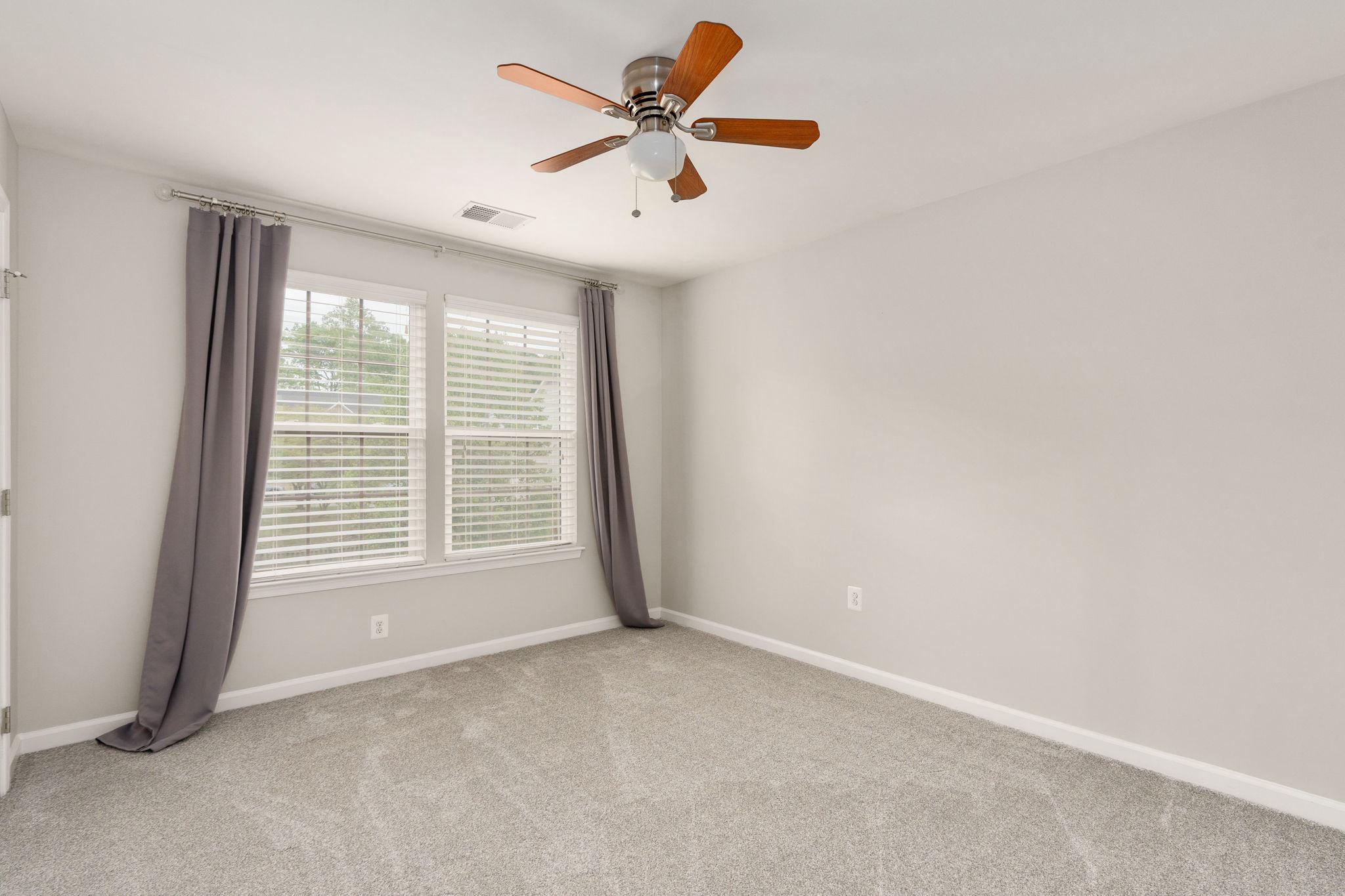 9417 Reservoir Road Fredericksburg, VA 22407 - Photo 50 of 76 a view of a livingroom with a ceiling fan and window