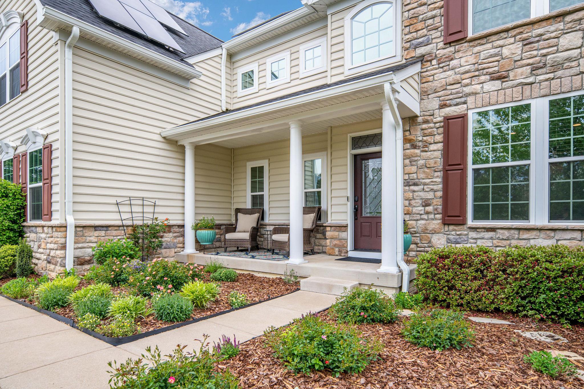 9417 Reservoir Road Fredericksburg, VA 22407 - Photo 5 of 76 a view of a house with potted plants and a table and chairs
