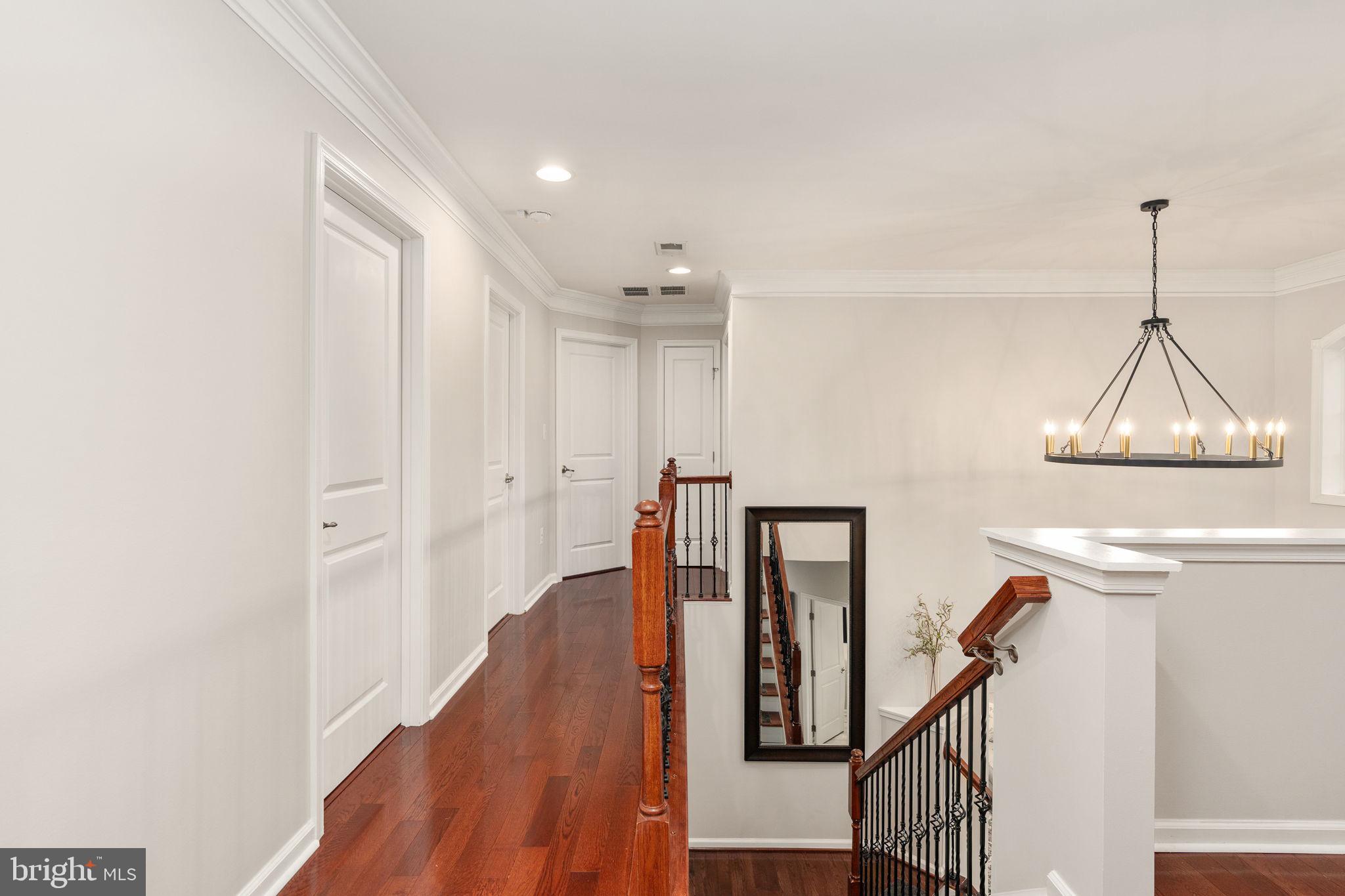 9417 Reservoir Road Fredericksburg, VA 22407 - Photo 50 of 80 Elegant hallway with rich wood accents.