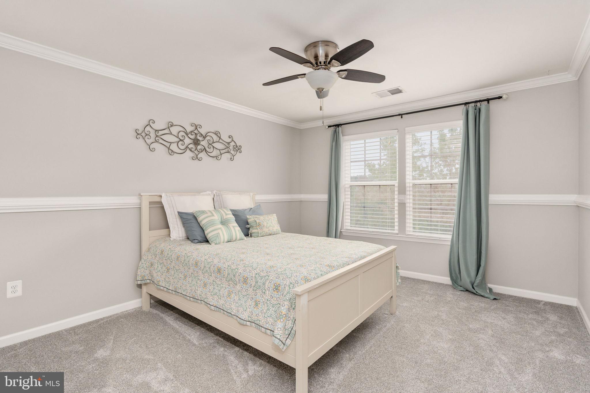 9417 Reservoir Road Fredericksburg, VA 22407 - Photo 51 of 80 Serene bedroom with natural light.