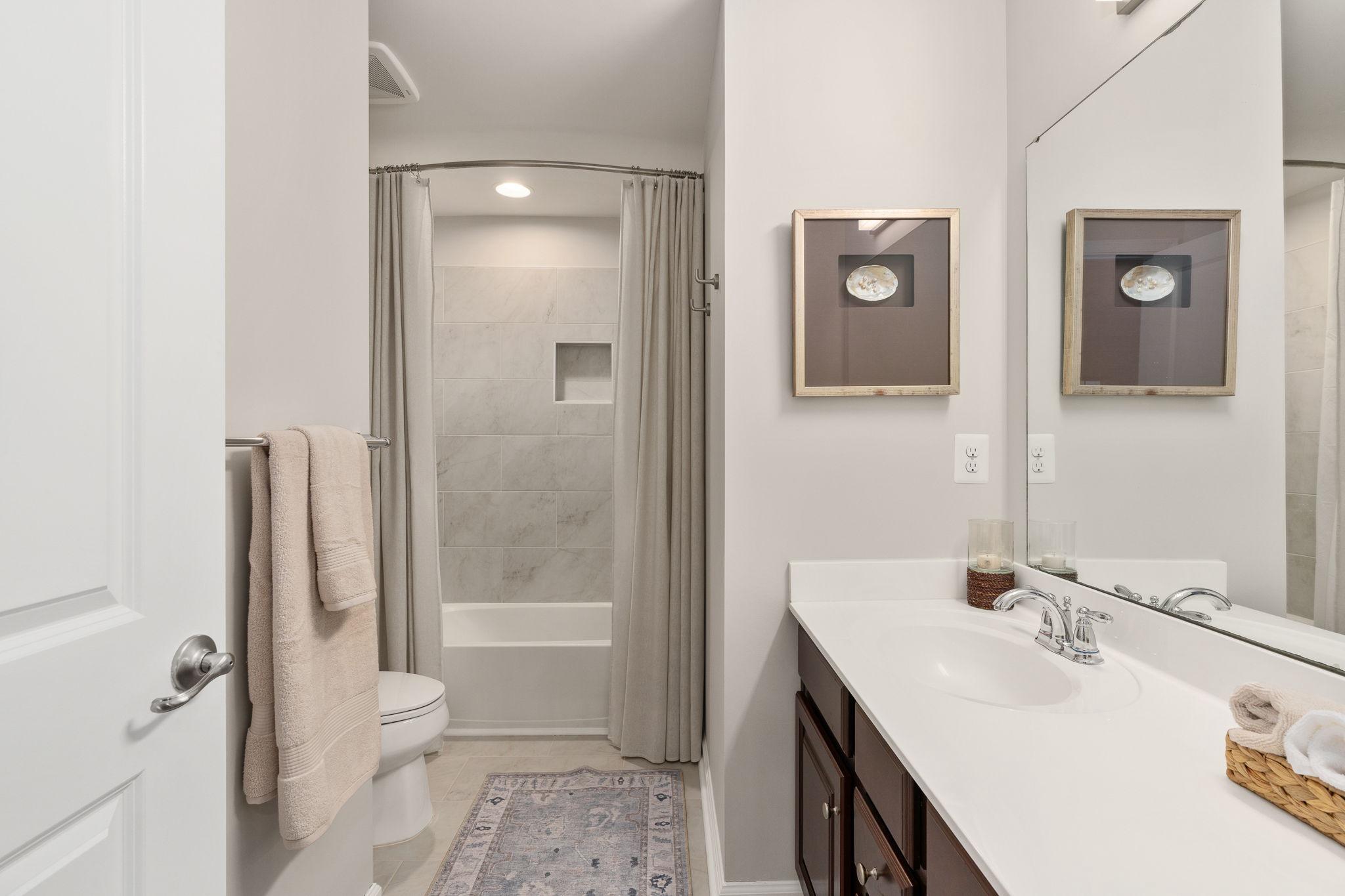 9417 Reservoir Road Fredericksburg, VA 22407 - Photo 52 of 76 a bathroom with a sink and a mirror
