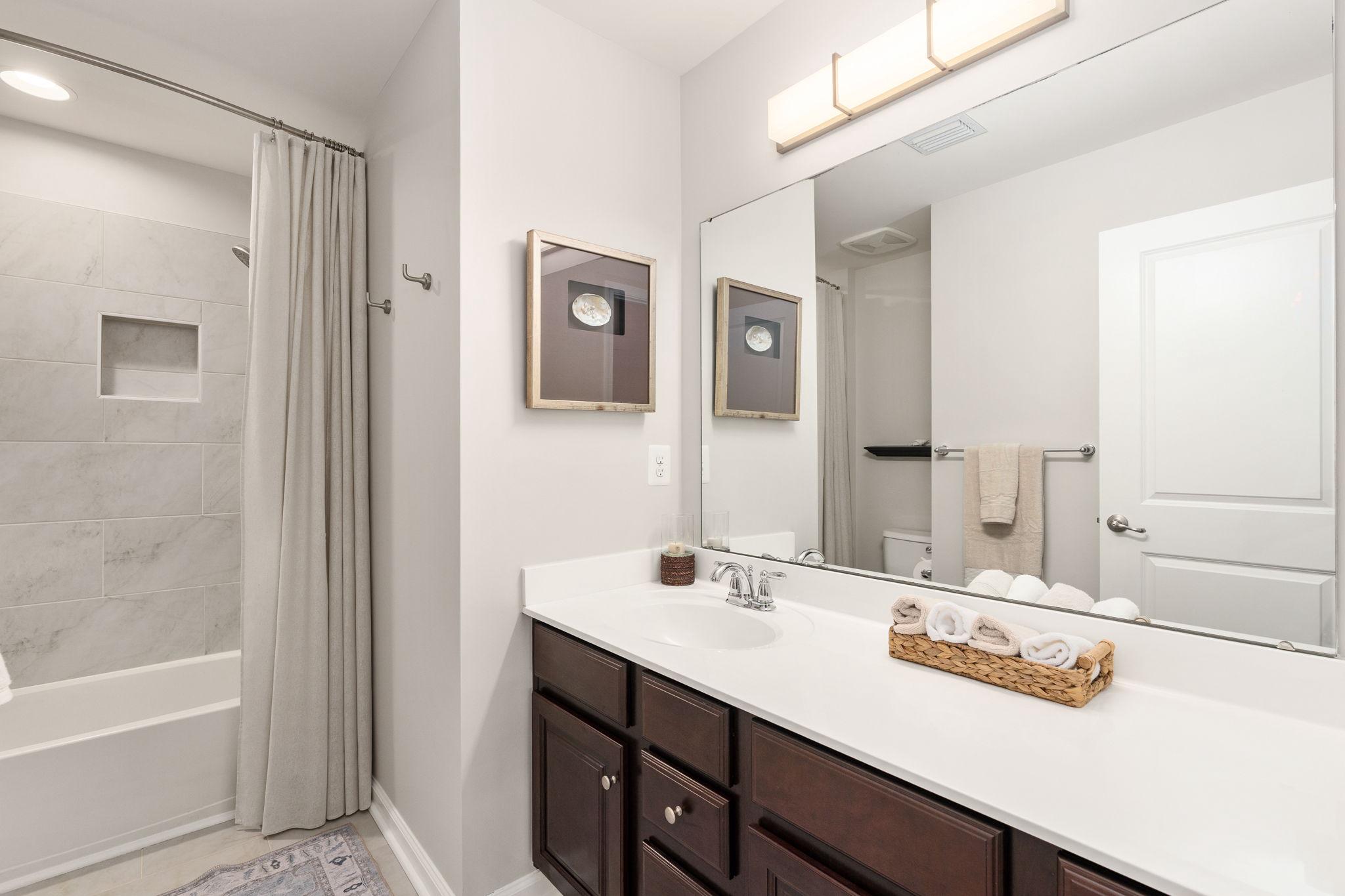 9417 Reservoir Road Fredericksburg, VA 22407 - Photo 53 of 76 a bathroom with a sink and a mirror