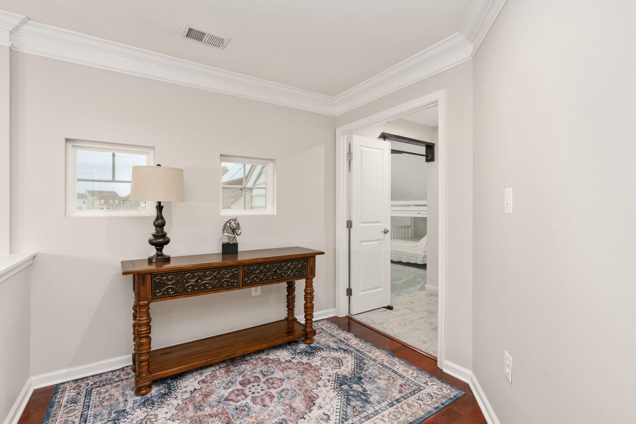 9417 Reservoir Road Fredericksburg, VA 22407 - Photo 55 of 76 a living room with a rug and a rug