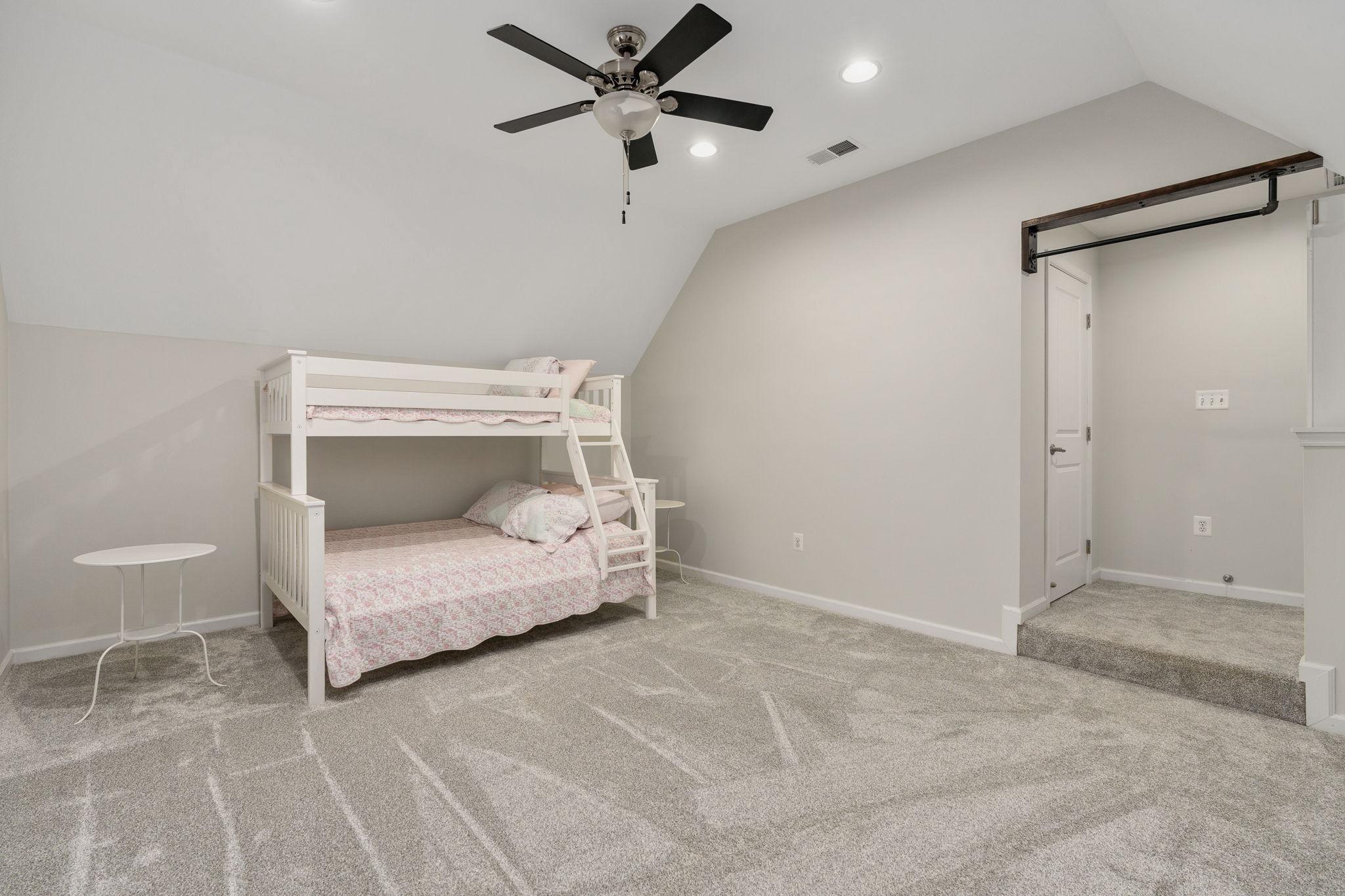 9417 Reservoir Road Fredericksburg, VA 22407 - Photo 57 of 76 a bedroom with a bed and a ceiling fan