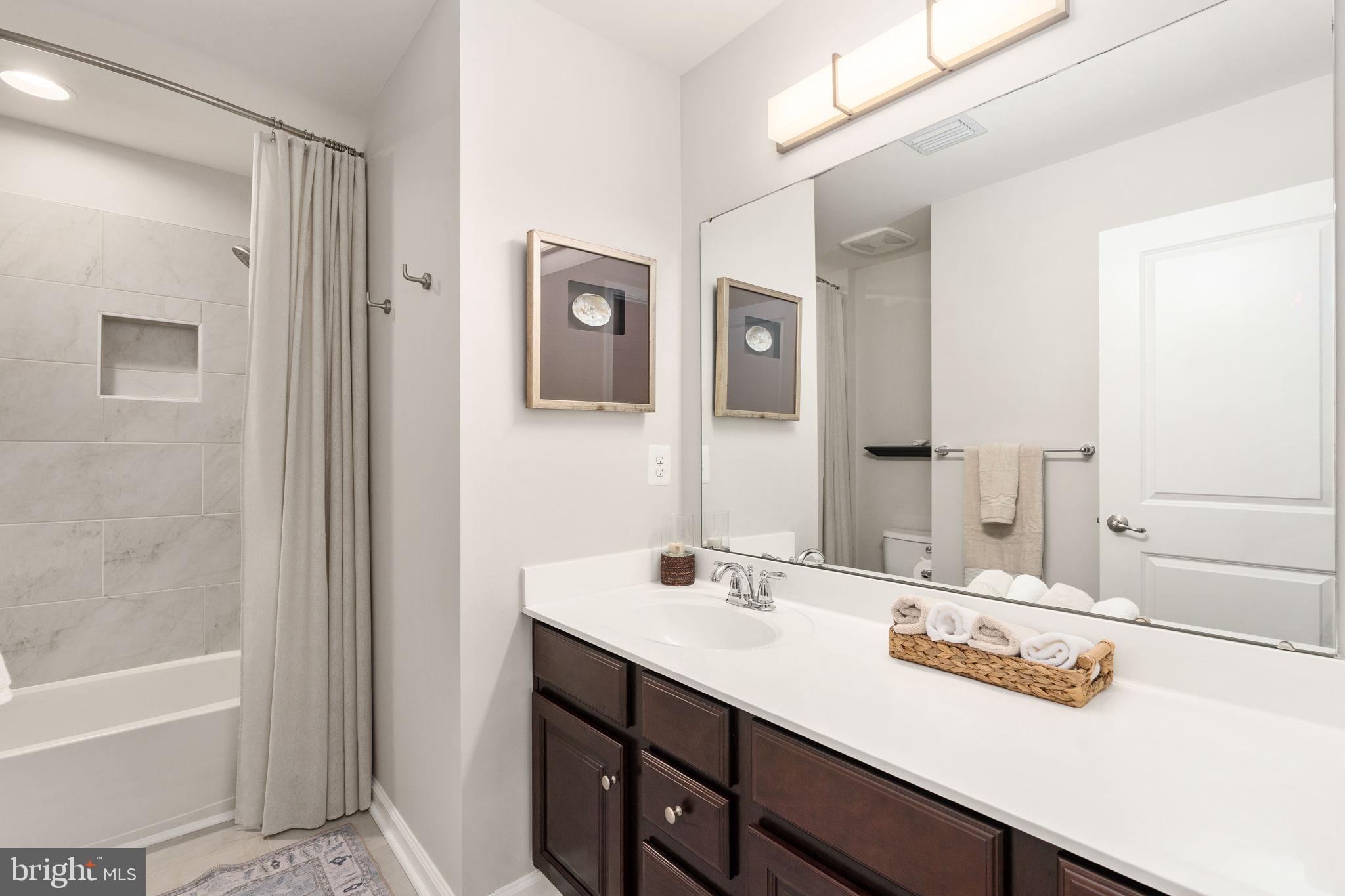 9417 Reservoir Road Fredericksburg, VA 22407 - Photo 56 of 80 Modern elegance in a serene bathroom.