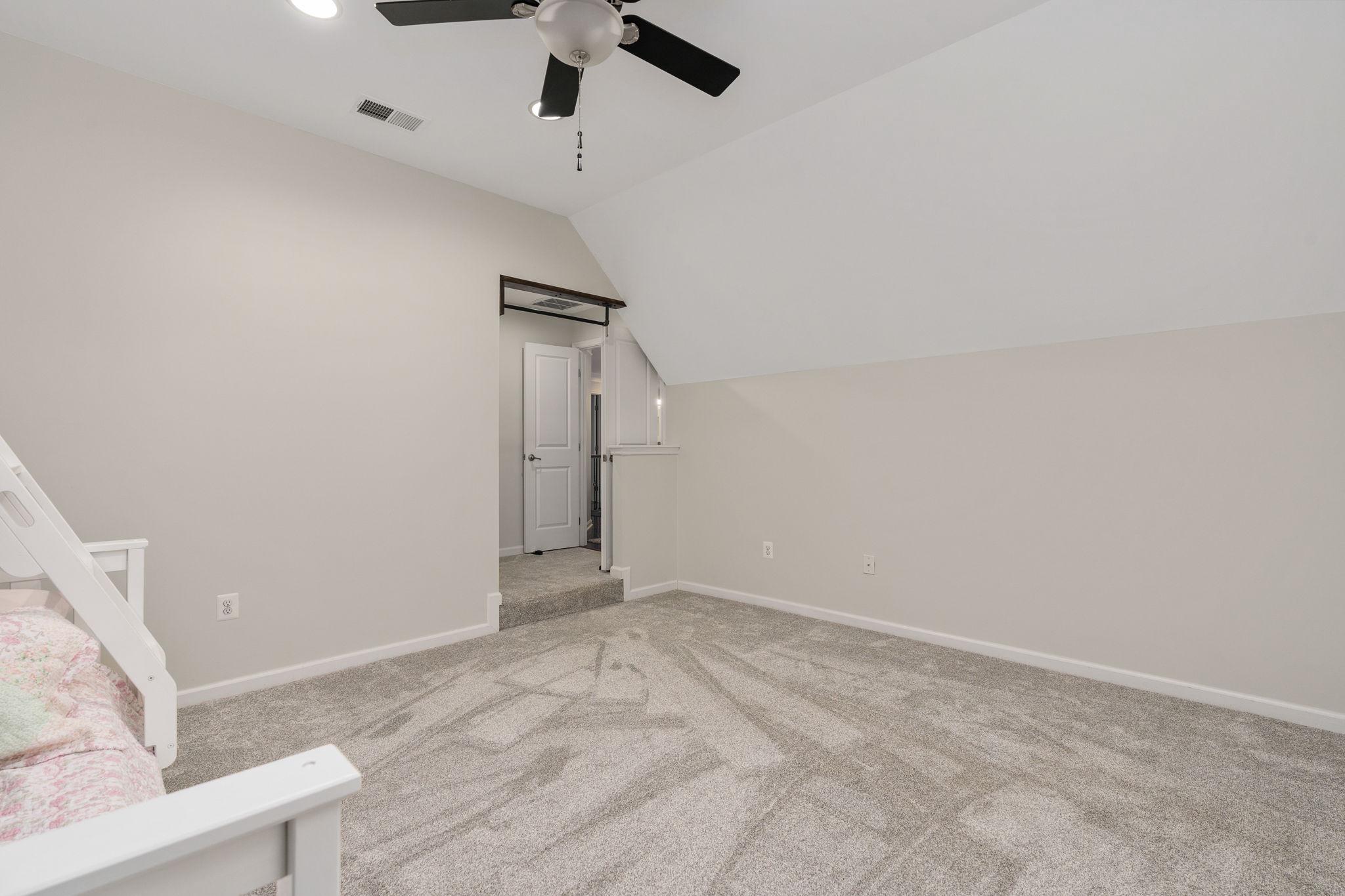 9417 Reservoir Road Fredericksburg, VA 22407 - Photo 58 of 76 an empty room with a ceiling fan and window
