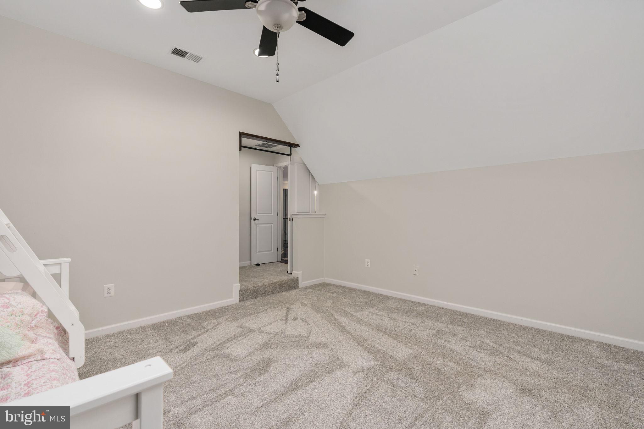 9417 Reservoir Road Fredericksburg, VA 22407 - Photo 62 of 80 Cozy attic retreat with soft lighting.