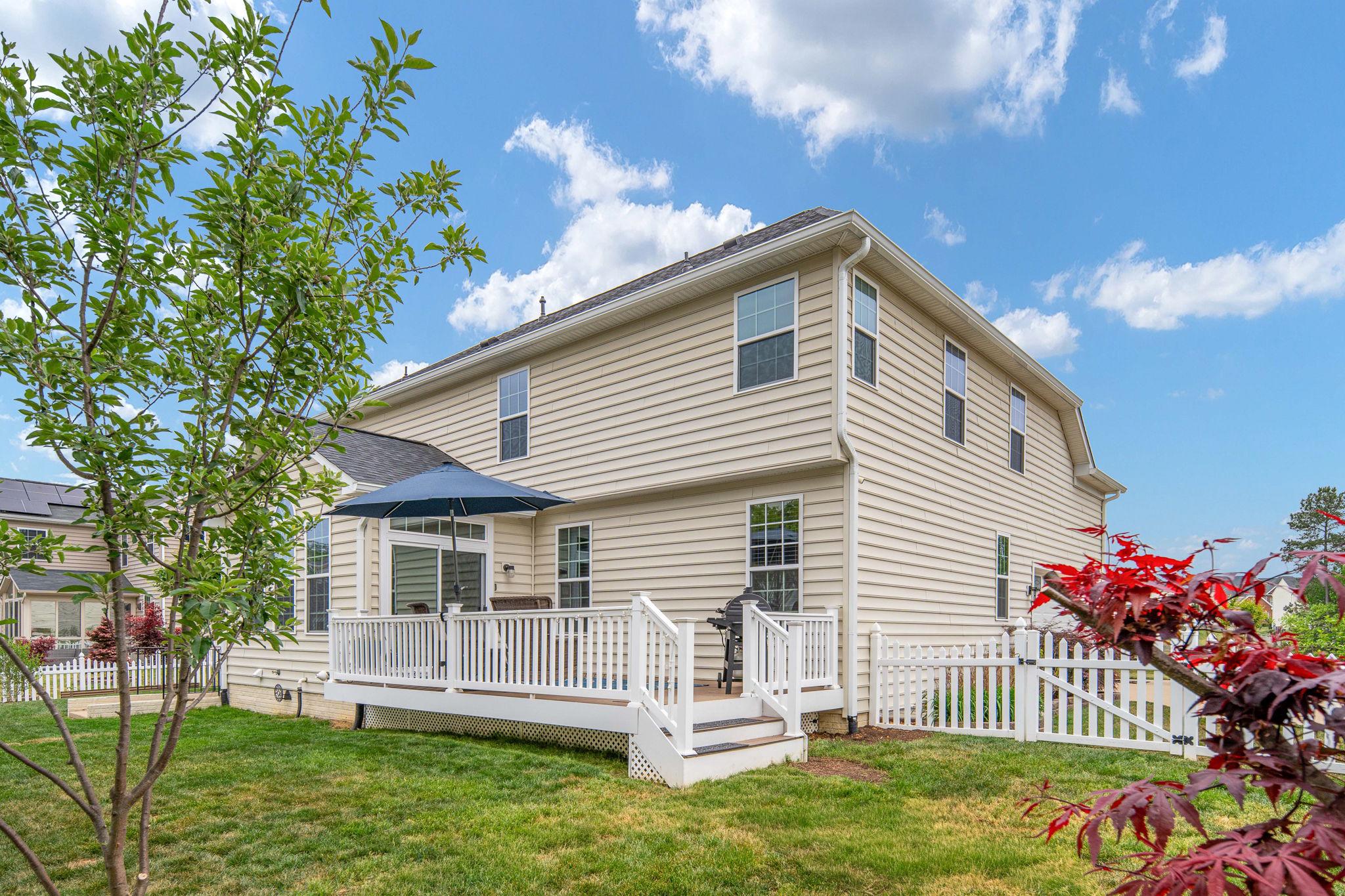 9417 Reservoir Road Fredericksburg, VA 22407 - Photo 64 of 76 a front view of a house with a garden