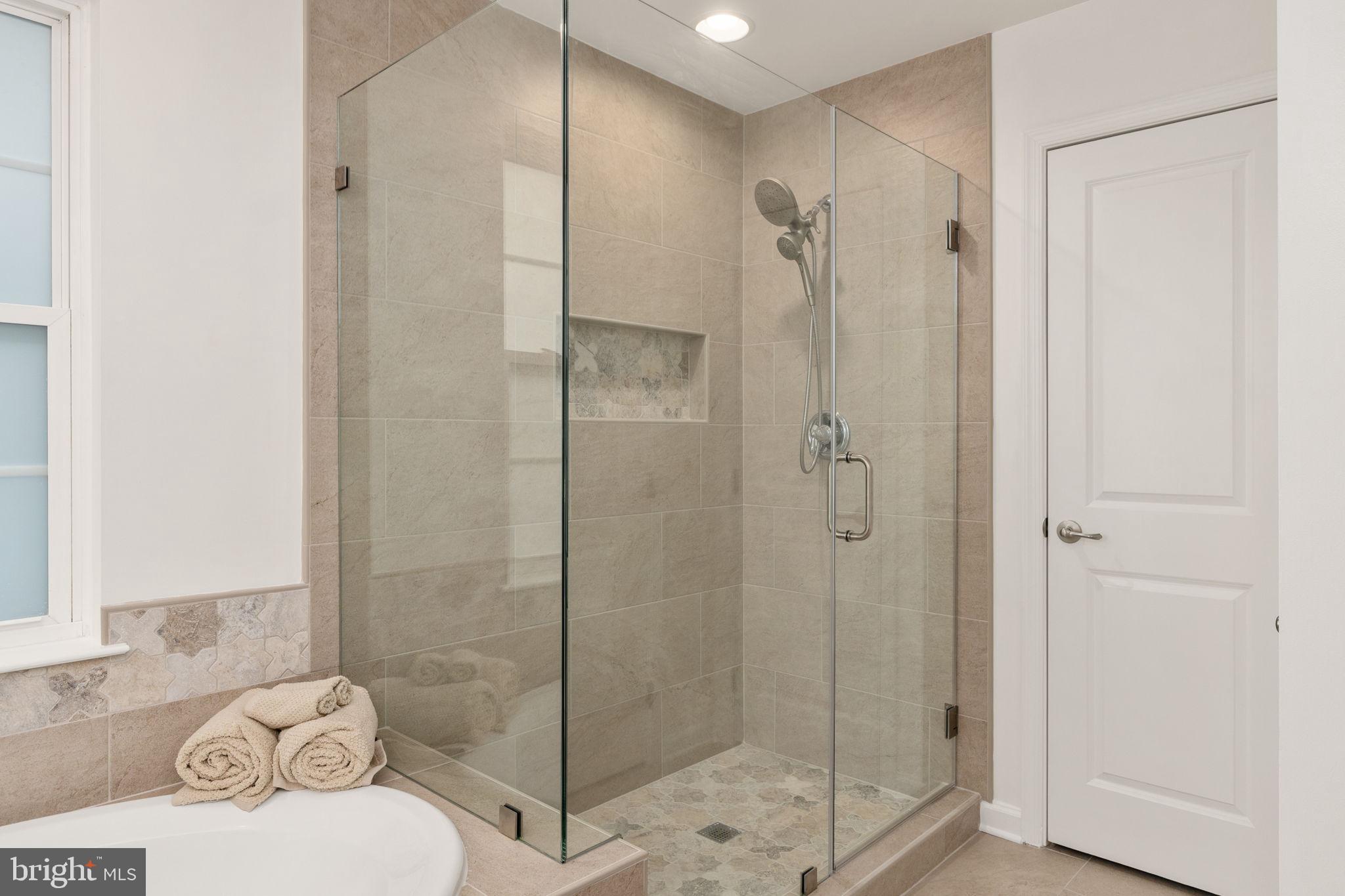9417 Reservoir Road Fredericksburg, VA 22407 - Photo 67 of 80 Sleek glass shower in modern bathroom.