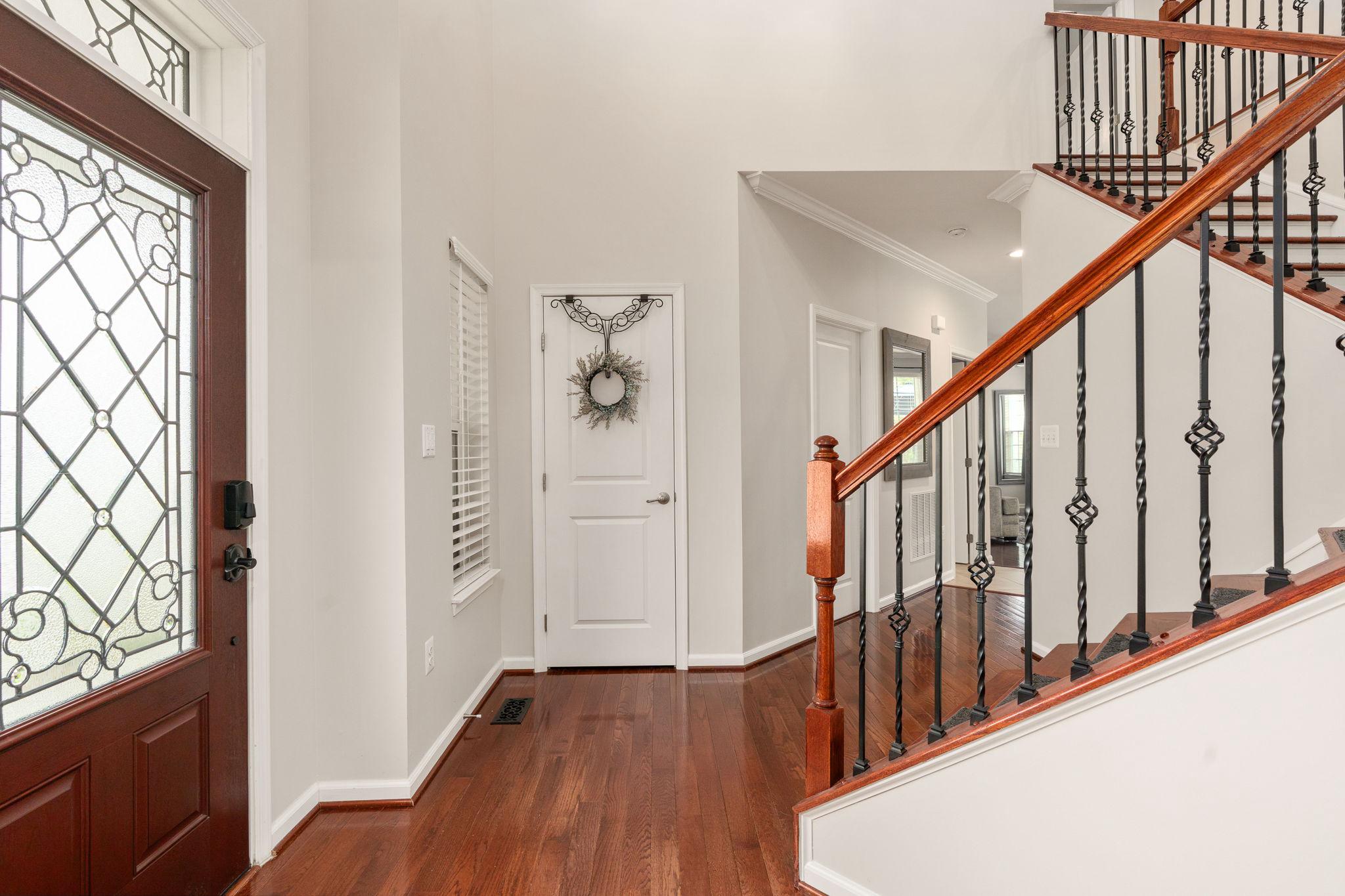 9417 Reservoir Road Fredericksburg, VA 22407 - Photo 8 of 76 a view of an entryway with wooden floor and stairs