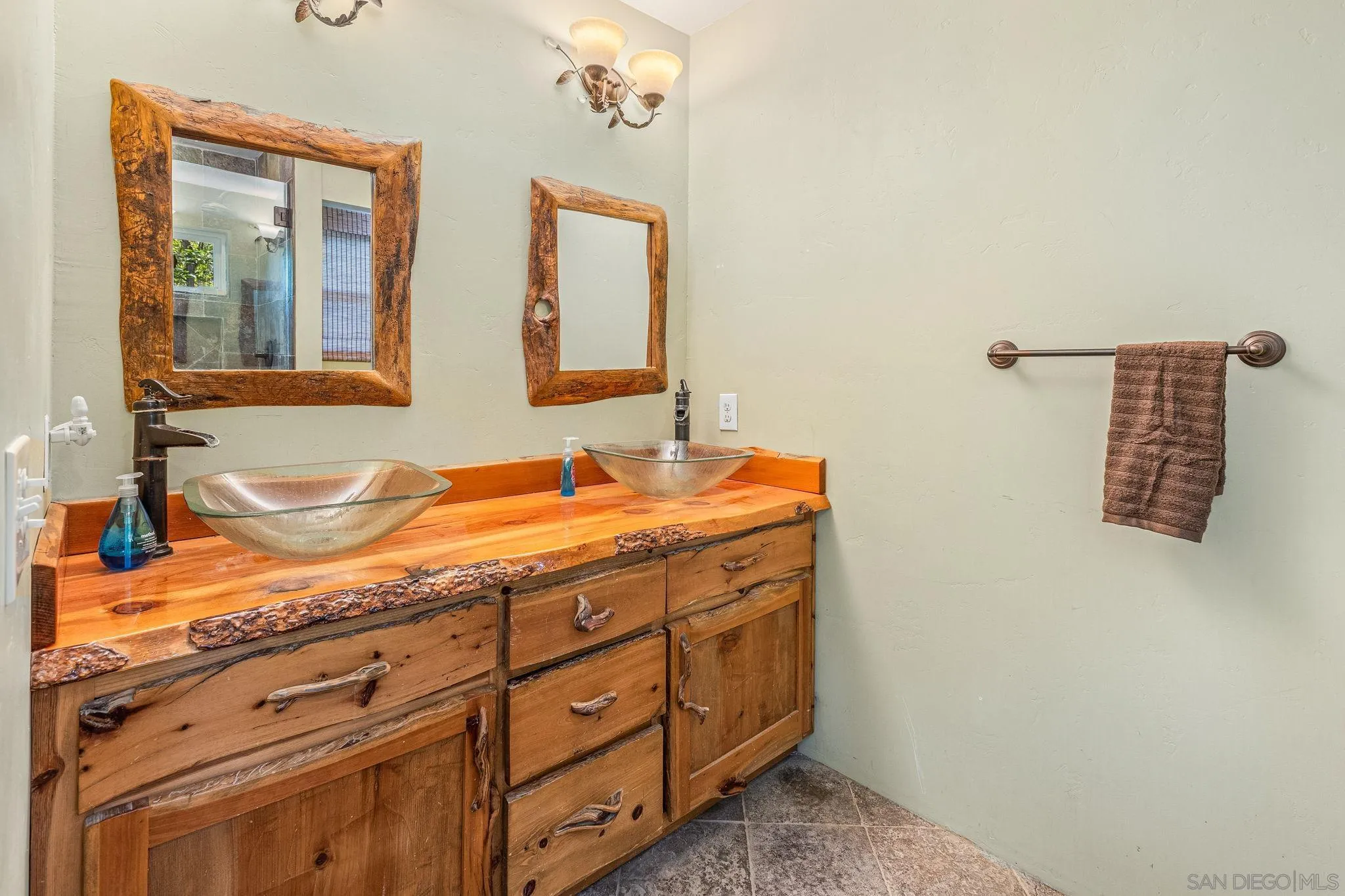 1590 Dorothea Avenue Fallbrook, CA 92028 - Photo 16 of 33 a bathroom with a granite countertop sink and a mirror