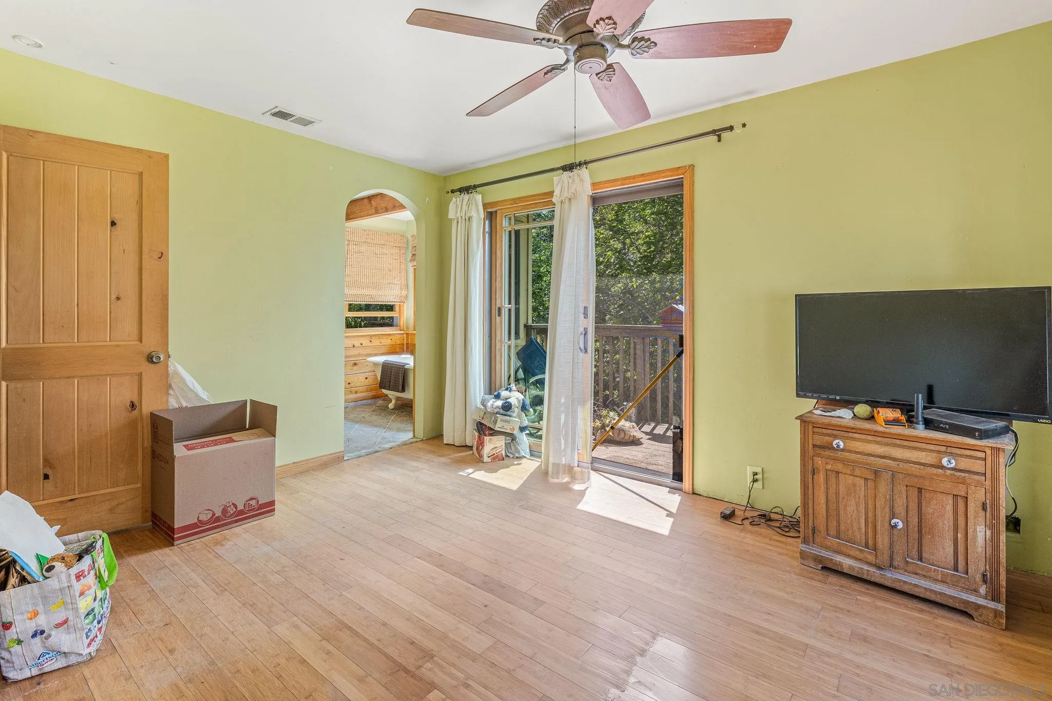 1590 Dorothea Avenue Fallbrook, CA 92028 - Photo 18 of 33 a bedroom with furniture and a flat screen tv