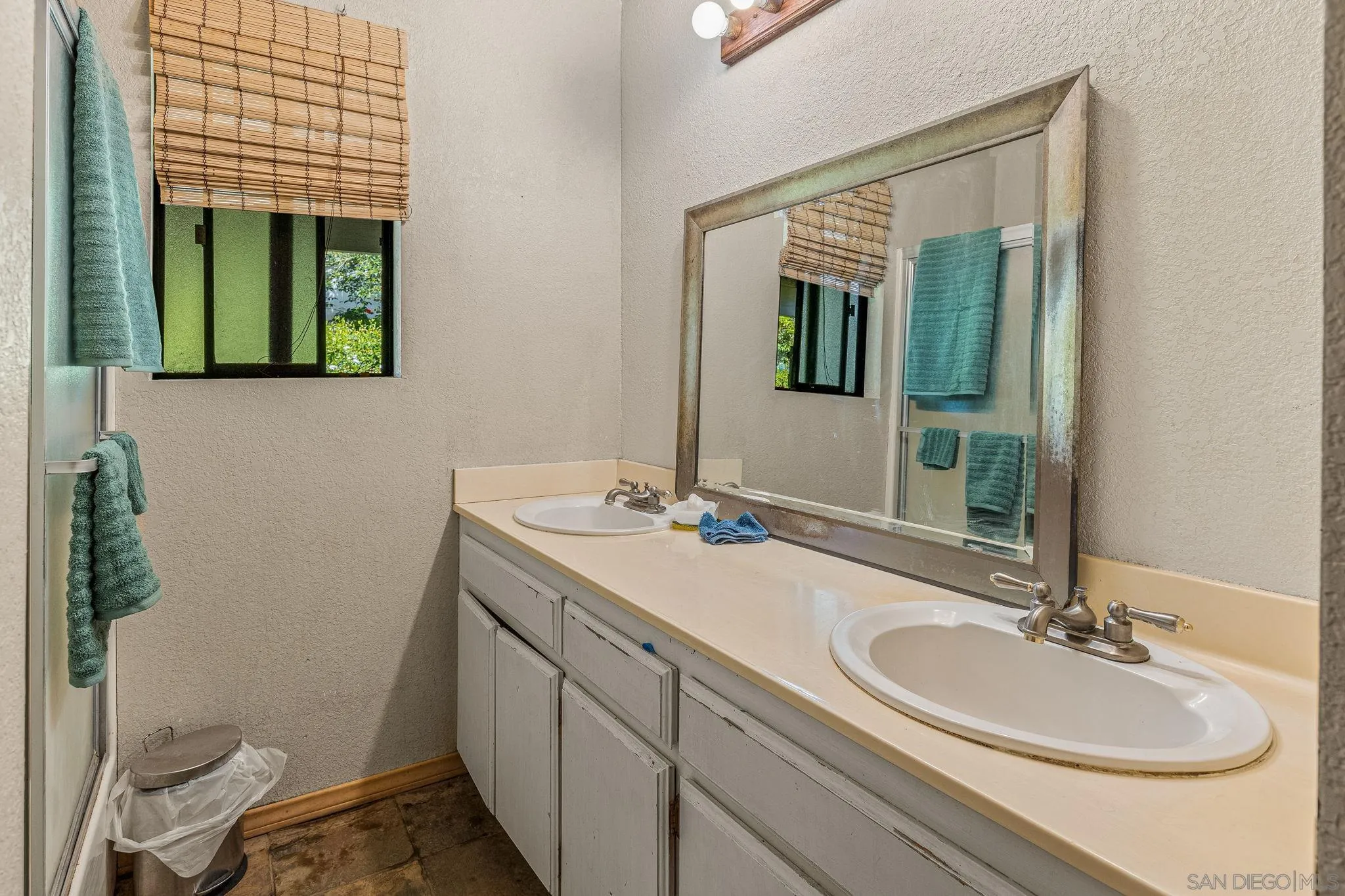 1590 Dorothea Avenue Fallbrook, CA 92028 - Photo 21 of 33 a bathroom with a sink and a mirror