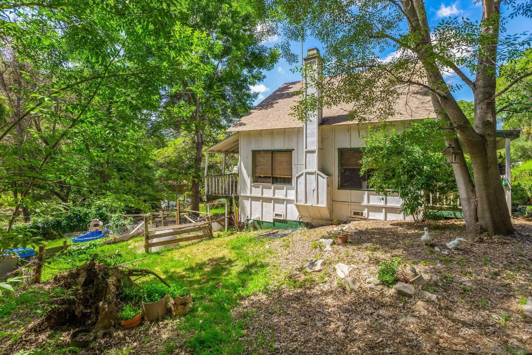 1590 Dorothea Avenue Fallbrook, CA 92028 - Photo 29 of 33 a view of a house with backyard and sitting area