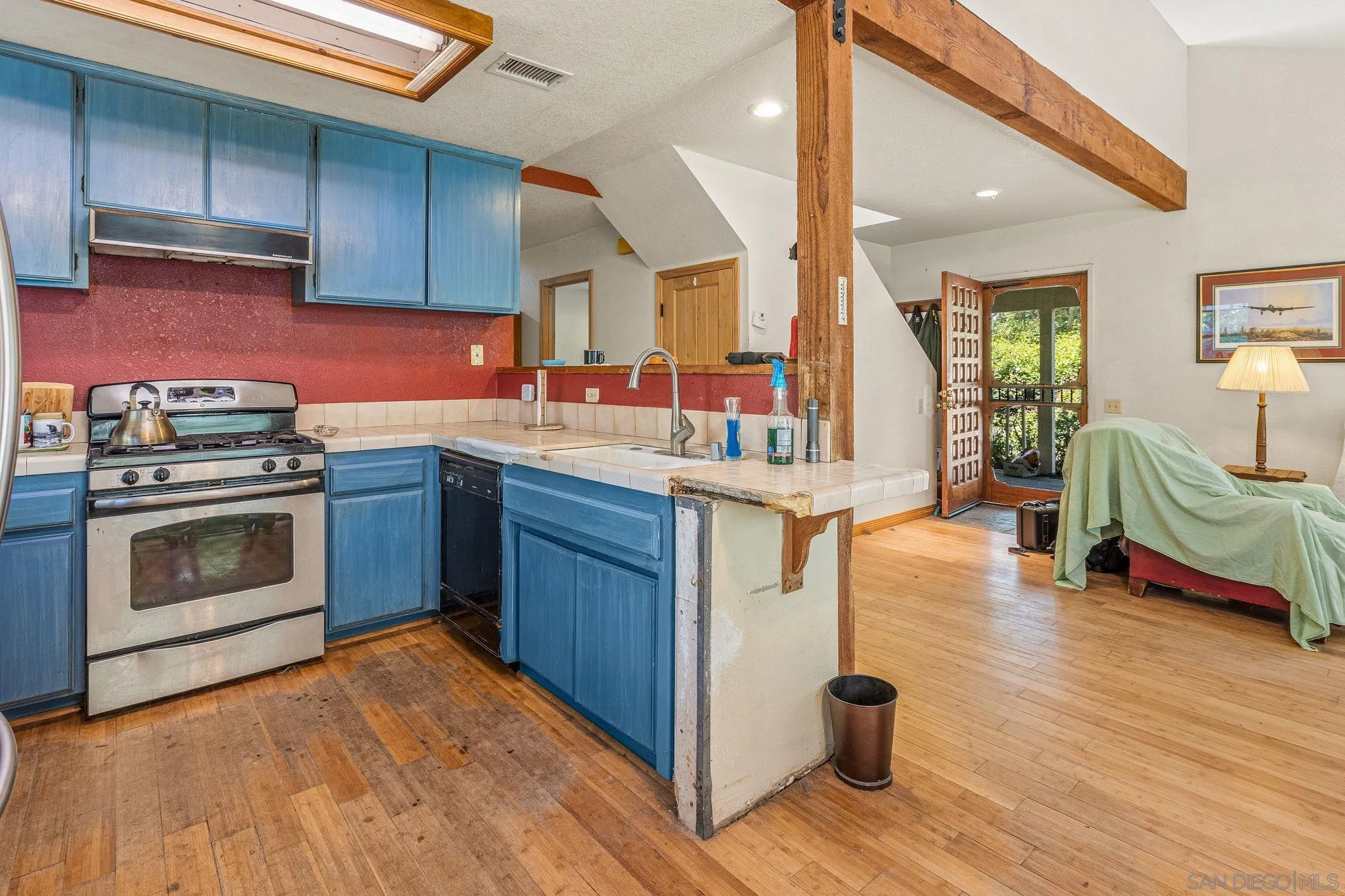 1590 Dorothea Avenue Fallbrook, CA 92028 - Photo 7 of 33 a kitchen with stainless steel appliances granite countertop a stove a sink dishwasher and a microwave oven with cabinets