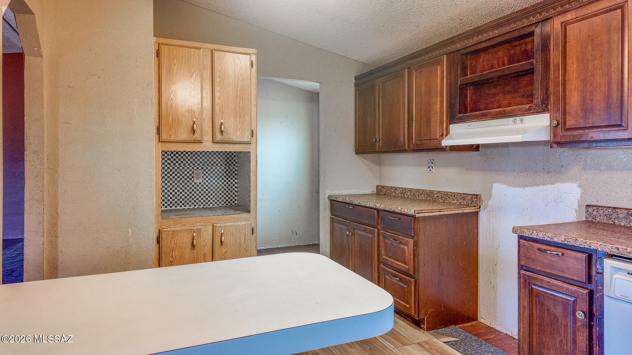 27651 South Canoa Road Amado, AZ 85645 - Photo 3 of 20 a kitchen with granite countertop a stove and a refrigerator