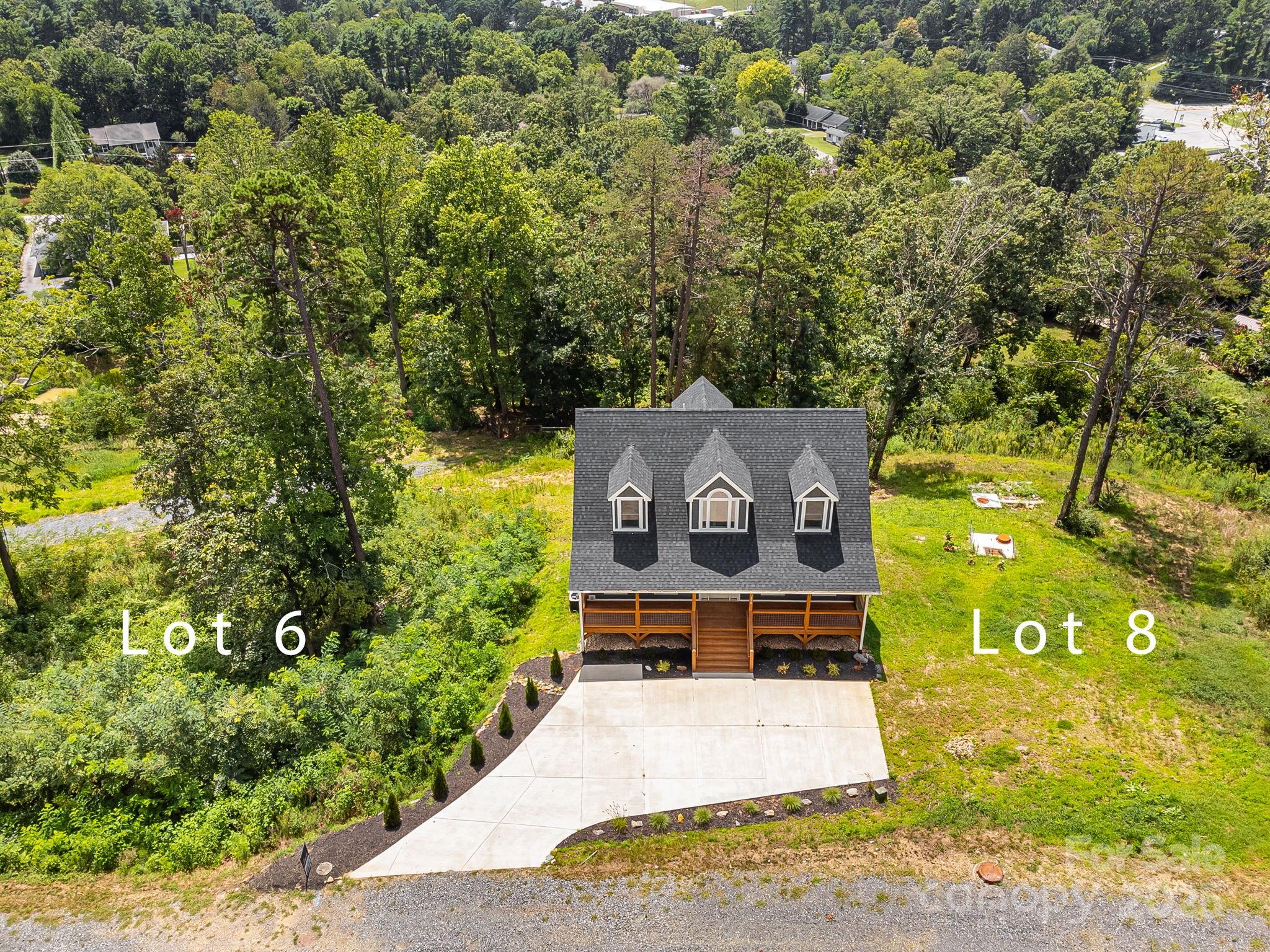344 Espen Ridge, Unit 8 Asheville, NC 28804 - Photo 4 of 13 an aerial view of a house with a yard