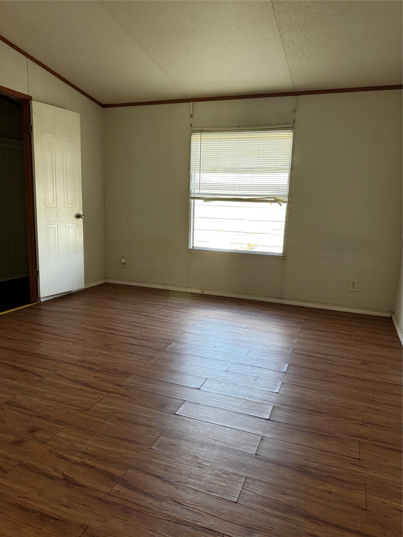 15930 Boss Gaston Road Sugar Land, TX 77498 - Photo 9 of 20 an empty room with wooden floor and windows