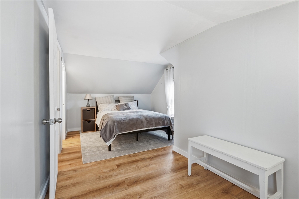 180 Wolcott Avenue West Springfield, MA 01089 - Photo 20 of 39 a bedroom with a bed and a chair