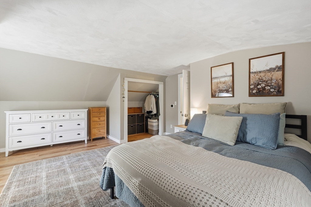 180 Wolcott Avenue West Springfield, MA 01089 - Photo 24 of 39 a bedroom with a bed and a night stand