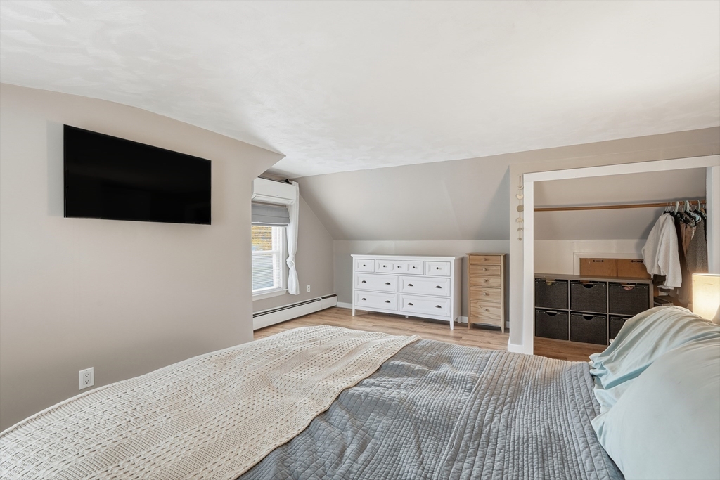 180 Wolcott Avenue West Springfield, MA 01089 - Photo 25 of 39 a bedroom with a bed and a flat screen tv