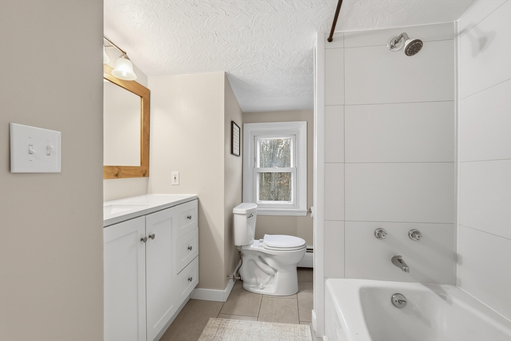 180 Wolcott Avenue West Springfield, MA 01089 - Photo 26 of 39 a bathroom with a bathtub toilet and sink