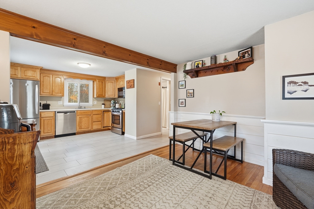 180 Wolcott Avenue West Springfield, MA 01089 - Photo 10 of 39 a view of kitchen with cabinets and wooden floor