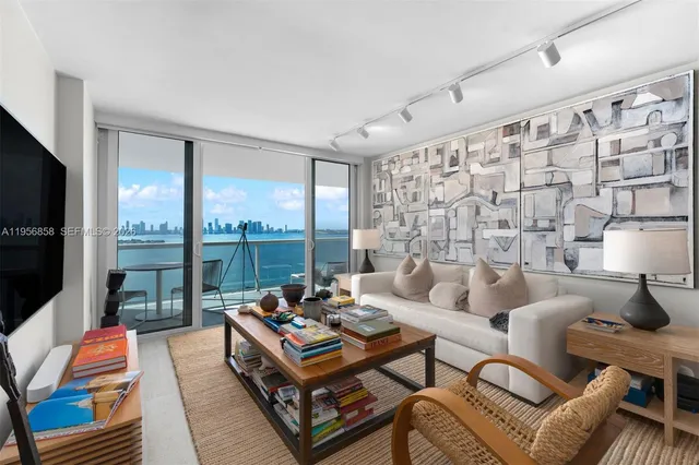 a view of a balcony with chair and a potted plant