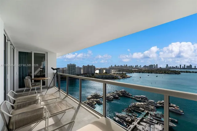 a view of a balcony with chairs