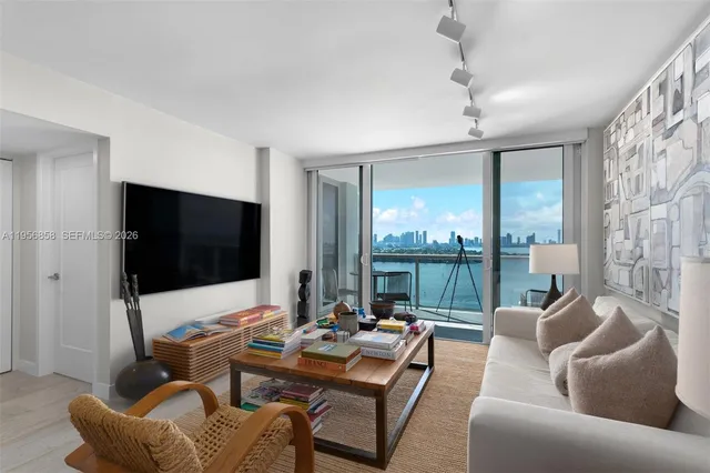 a work room with furniture and a flat screen tv
