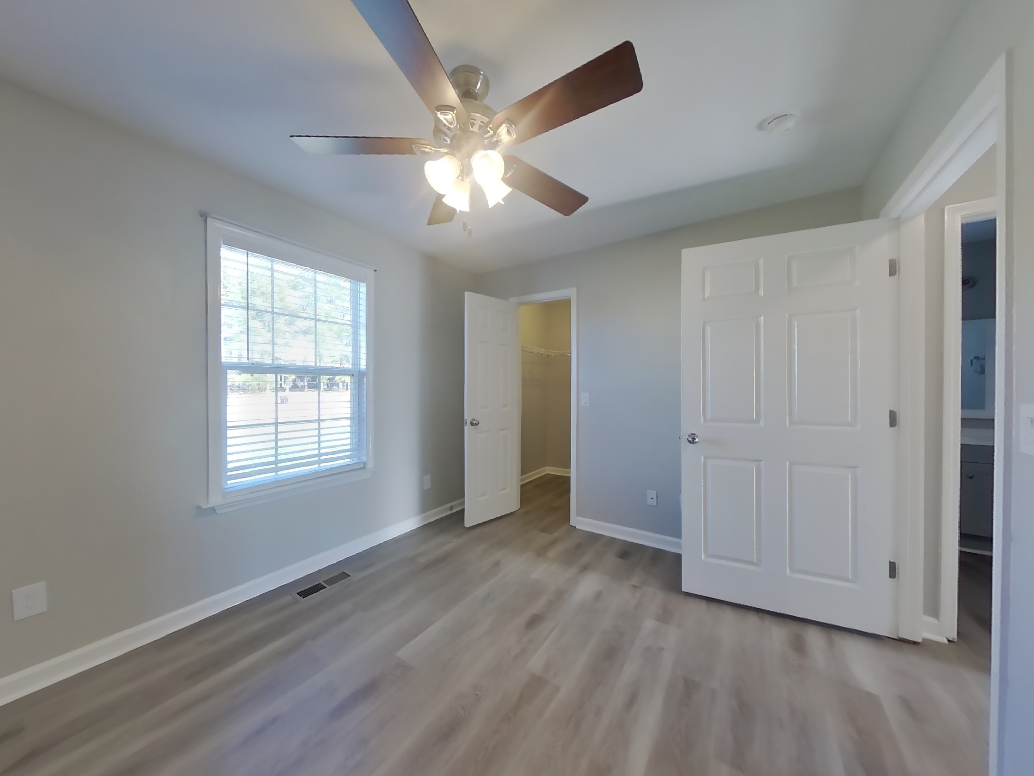 1612 Robert Road Columbia, TN 38401 - Photo 12 of 15 a view of an empty room with wooden floor and a window