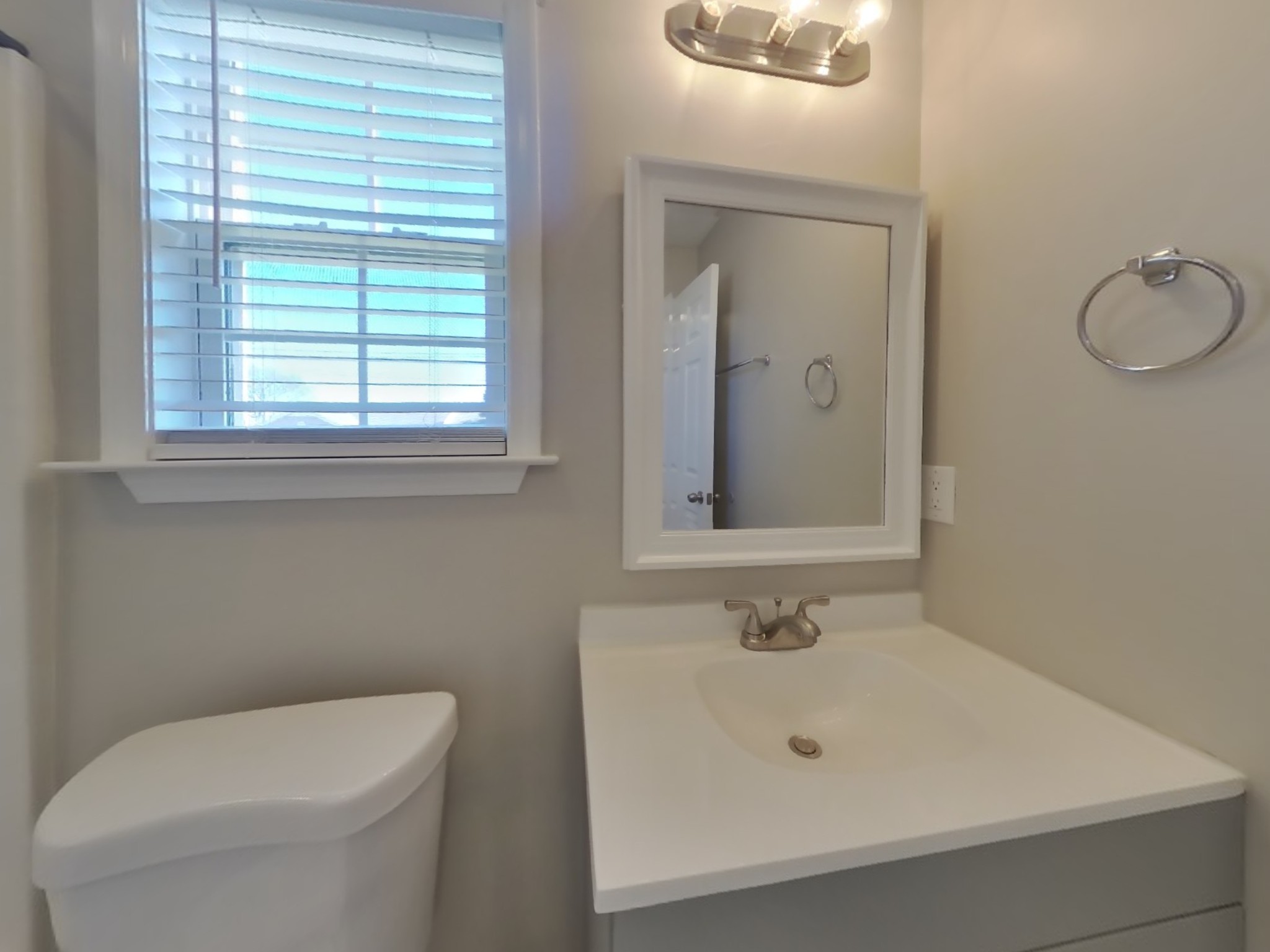 1612 Robert Road Columbia, TN 38401 - Photo 13 of 15 a bathroom with a sink a toilet and mirror