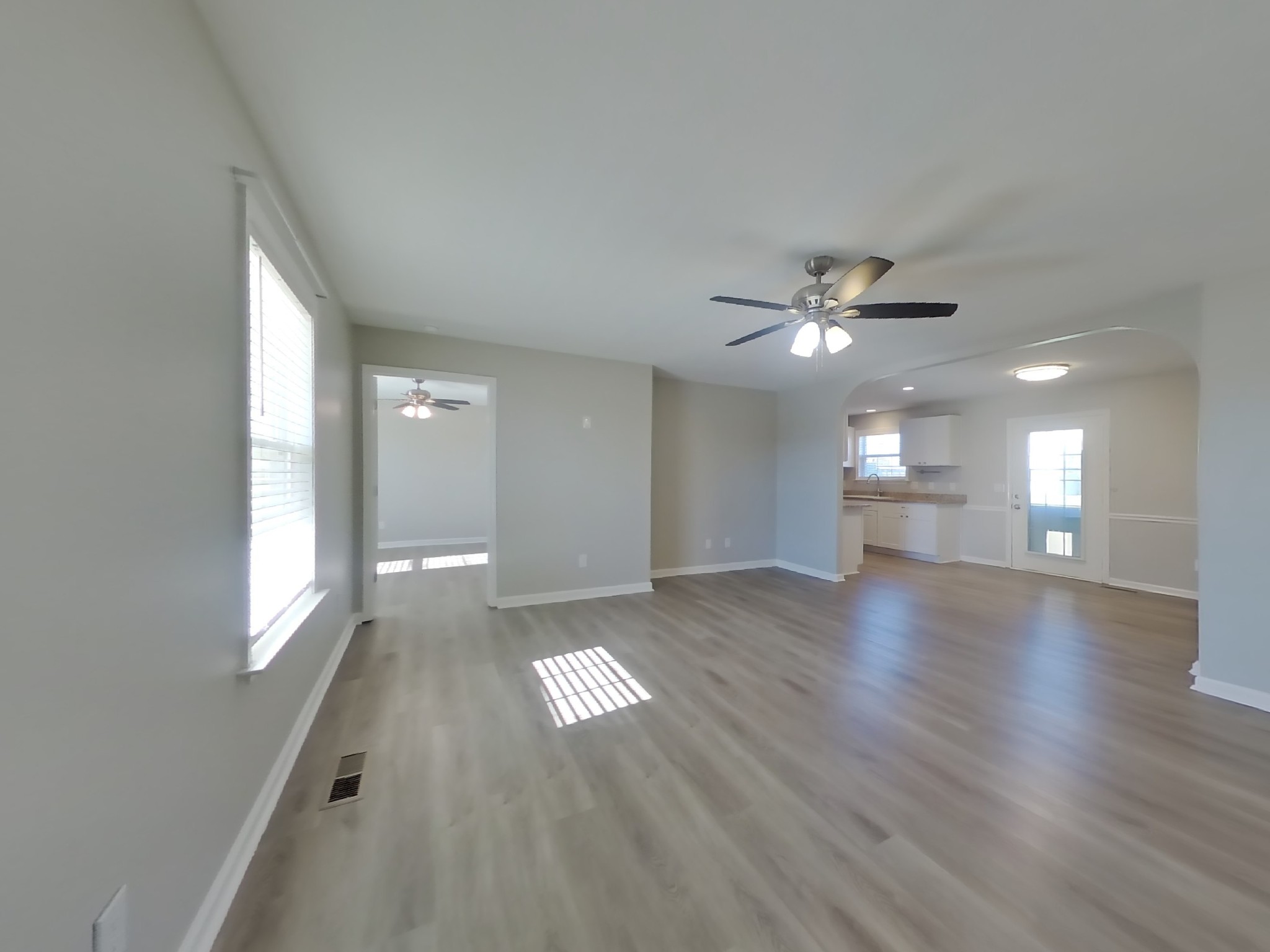 1612 Robert Road Columbia, TN 38401 - Photo 2 of 15 a view of an empty room with window and wooden floor