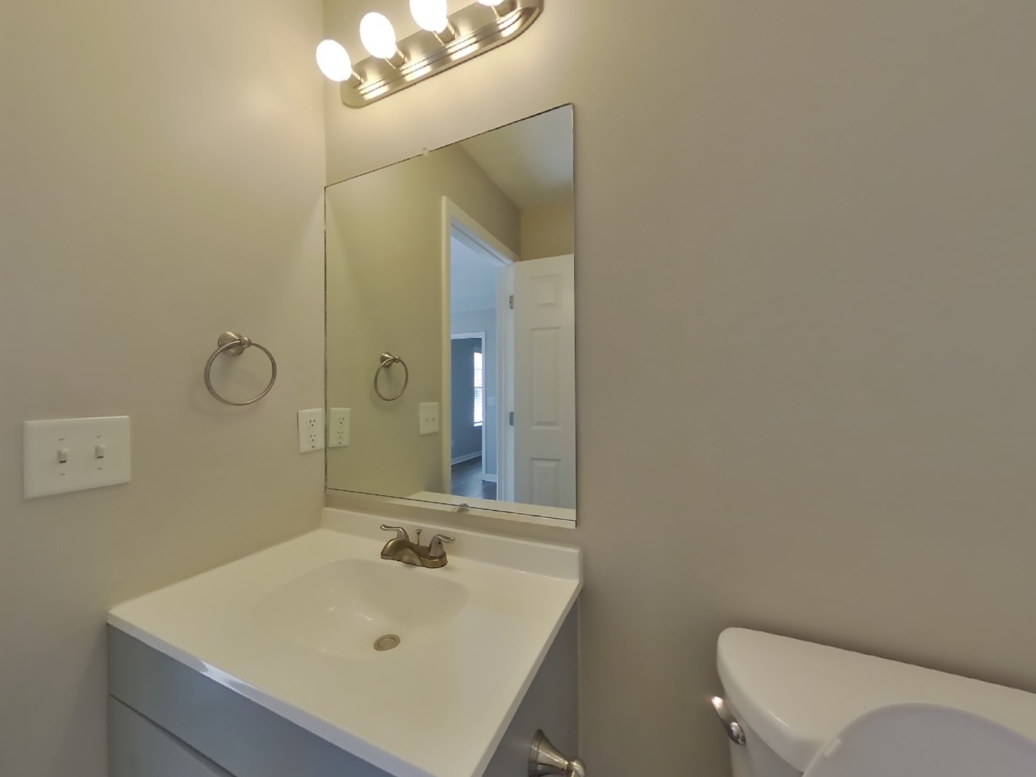 1612 Robert Road Columbia, TN 38401 - Photo 8 of 15 a bathroom with a sink a toilet and mirror