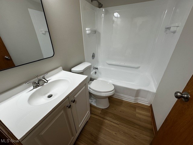 6606 Crossview Road Independence, OH 44131 - Photo 17 of 17 Full bath featuring vanity, bathtub / shower combination, and dark wood-style flooring