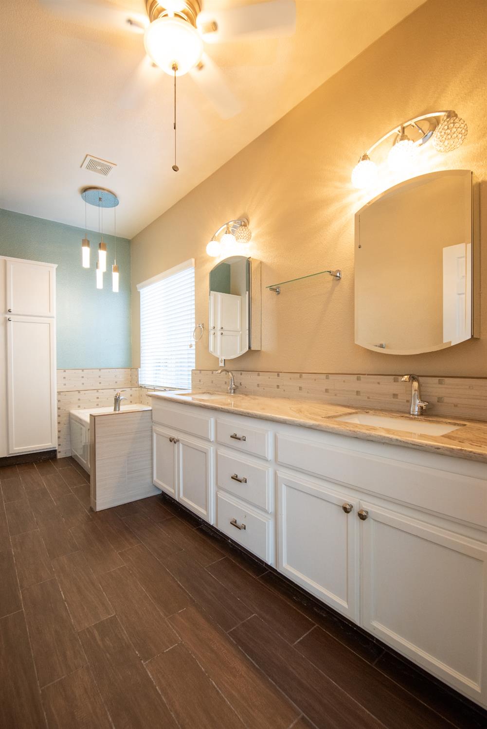 3601 Chant Drive Modesto, CA 95355 - Photo 12 of 23 a spacious bathroom with a double vanity sink and a mirror