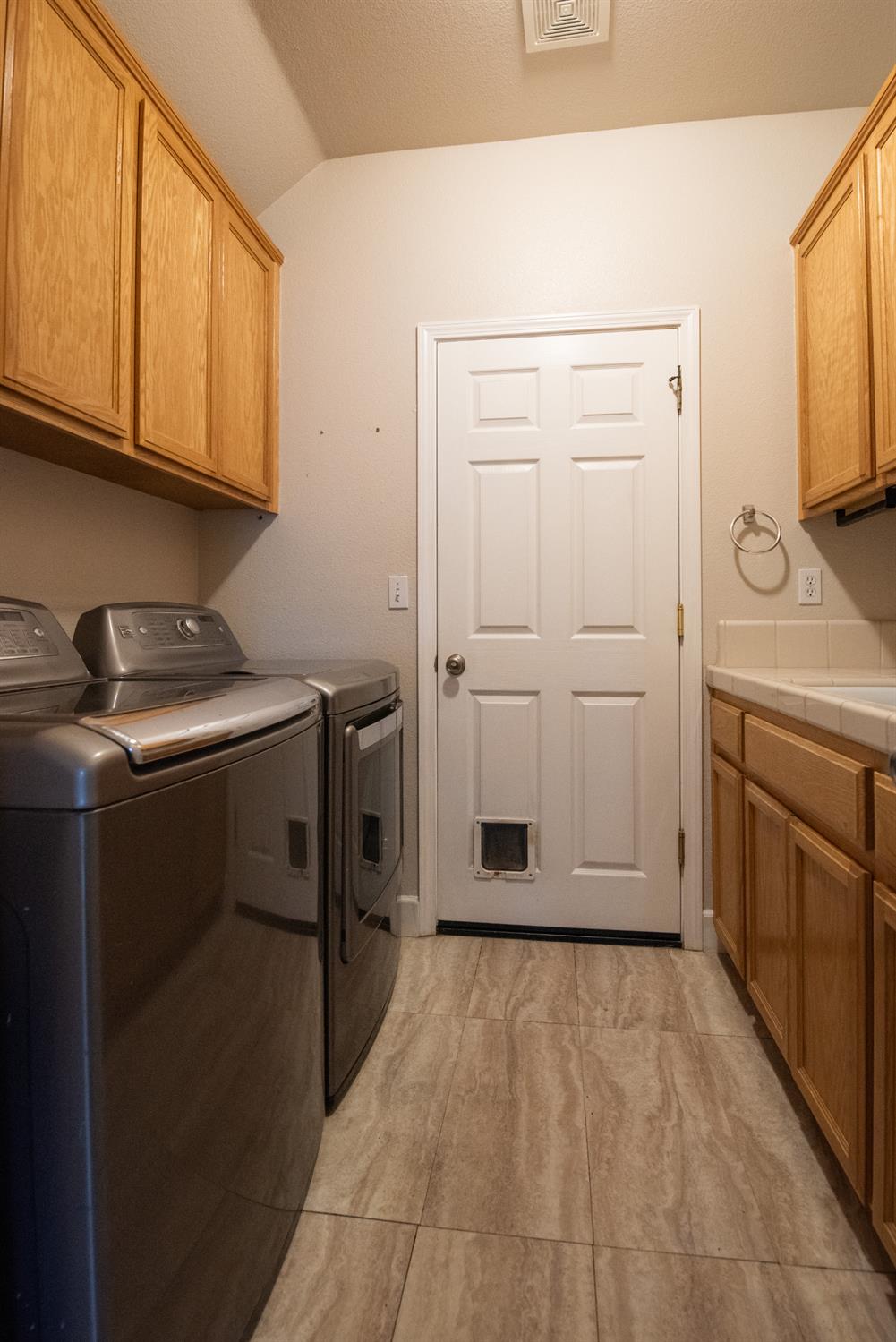 3601 Chant Drive Modesto, CA 95355 - Photo 15 of 23 a view of a storage and utility room with washer and dryer