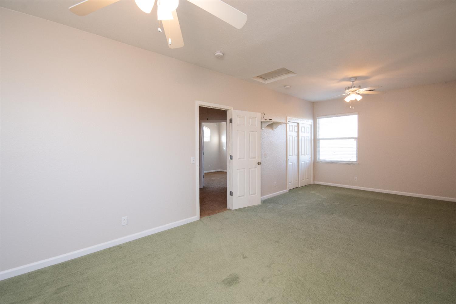 3601 Chant Drive Modesto, CA 95355 - Photo 17 of 23 an empty room with windows and ceiling fan